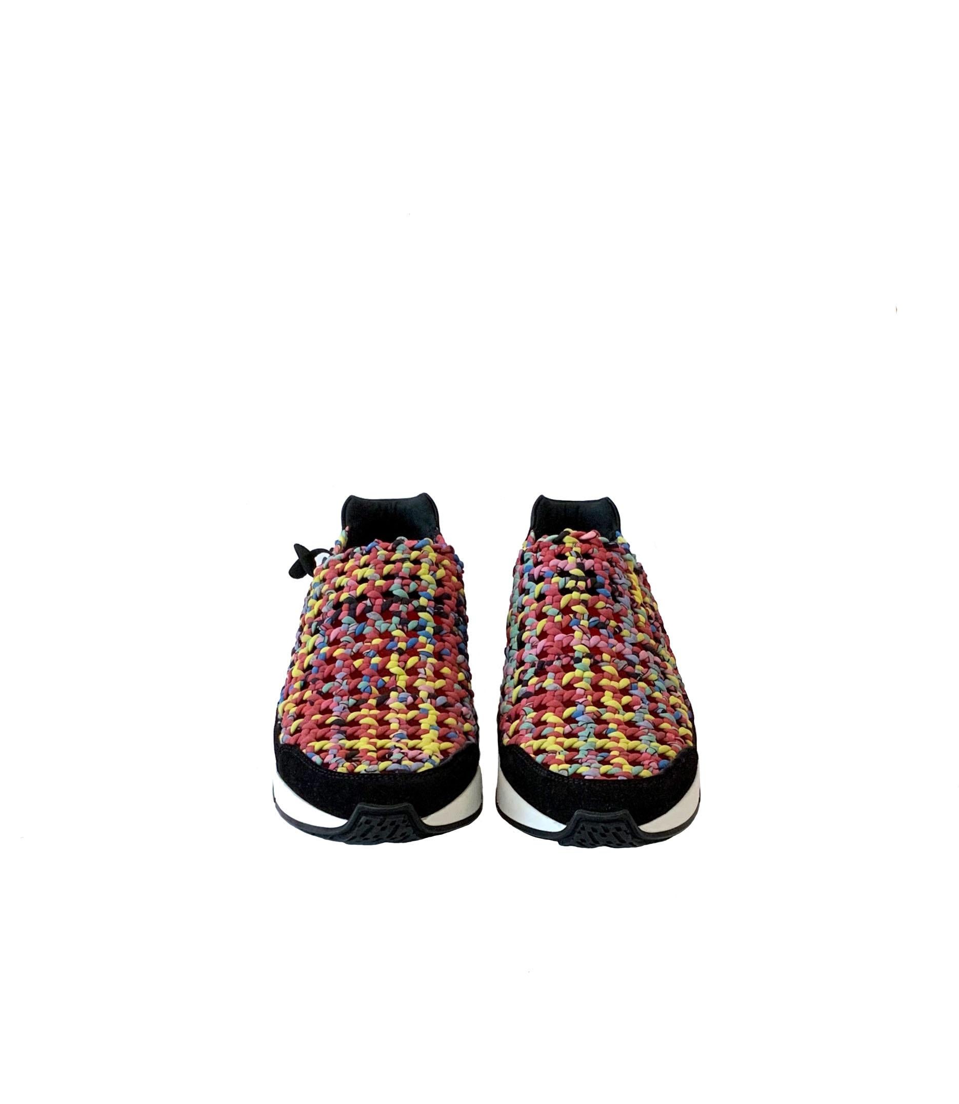 These pre-owned but as new, Hermès slip-on sneakers are hand-woven in a multi-coloured jersey print 