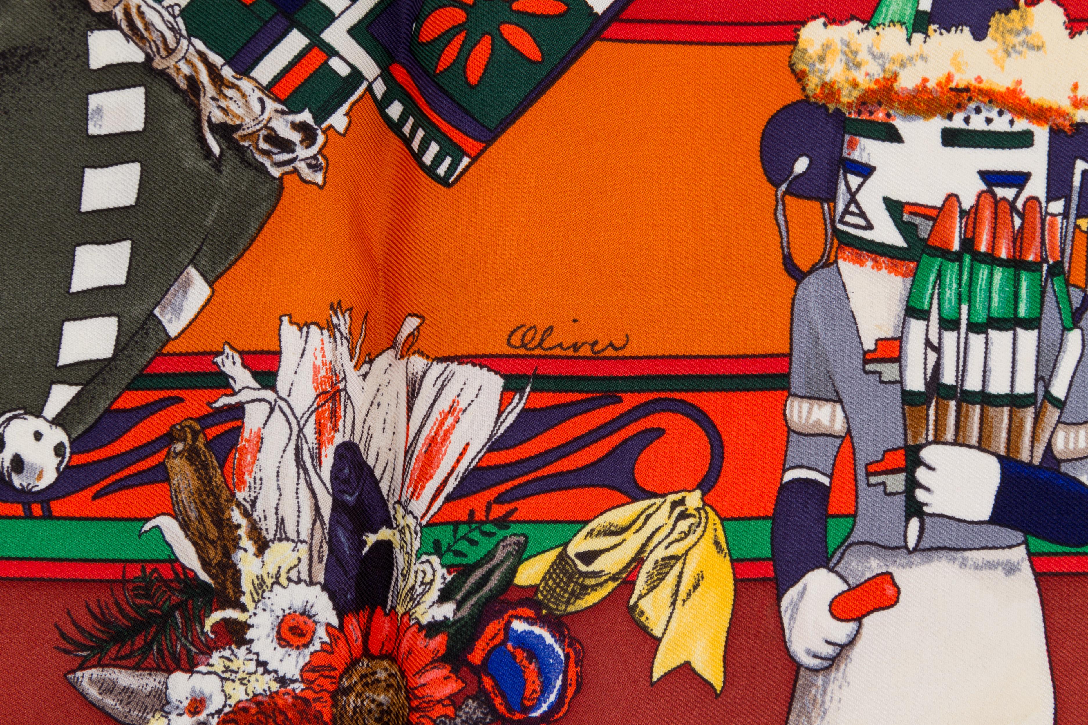 Hermès rust silk twill Kachinas scarf designed by Kermit Oliver. Hand-rolled edges. Box included. 