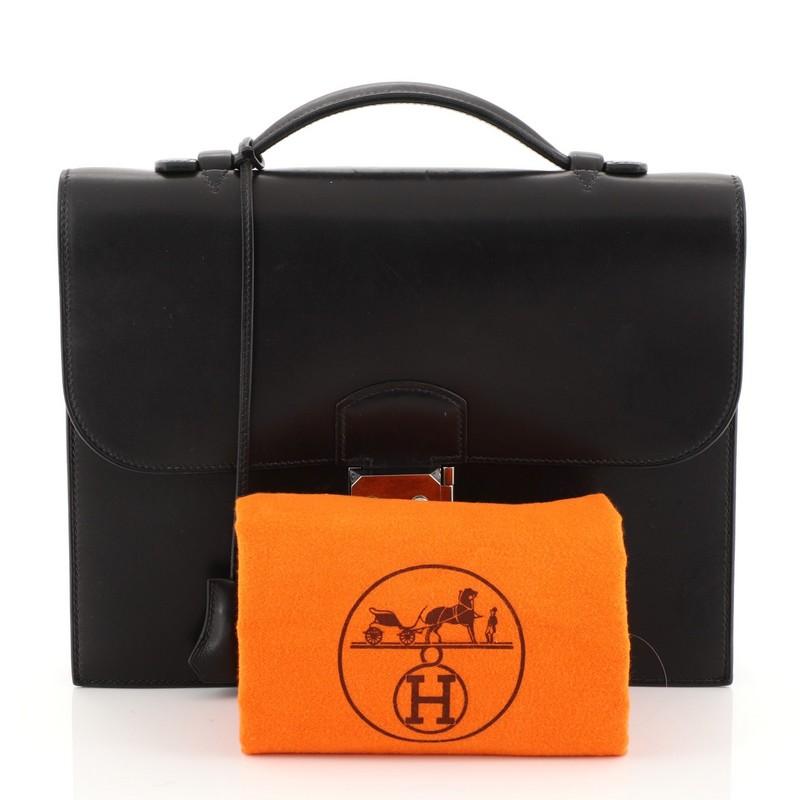 This Hermes Sac a Depeches Bag Barenia 27, crafted from Noir black Barenia leather, features flat top handle, accordion side gussets, and palladium hardware. Its flip-lock closure opens to a Noir black raw leather interior. Date stamp reads: H