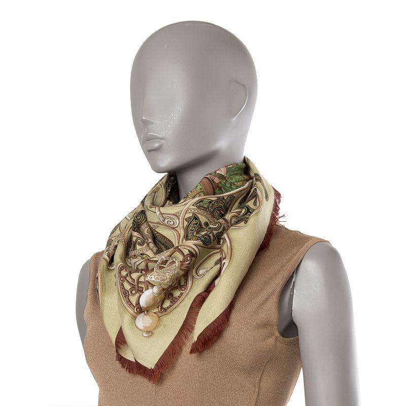 Hermes 'La Charmante aux Animaux' shall in pale olive green cashmere and silk with chestnut brown fringe and details in beige, green, brown and cognac. Has been worn and is in virtually new condition.

Width 90cm (35.1in)
Height 90cm (35.1in)