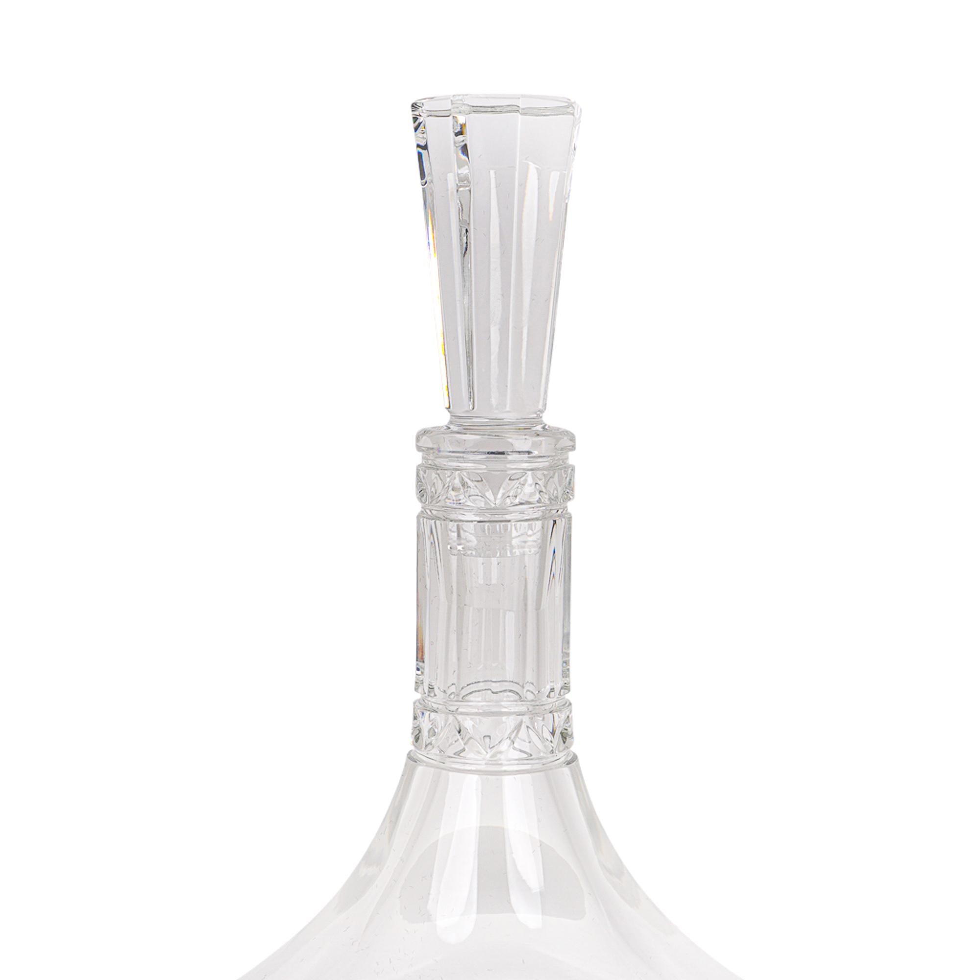 Mightychic offers an Hermes Iskender crystal wine decanter.
Modern and elegant with faceted details.
Octagonal faceted stopper.
Cristal Hermes Paris acid etched on bottom.
Comes with signature Saint Louis box.
New or Store Fresh Condition.
final
