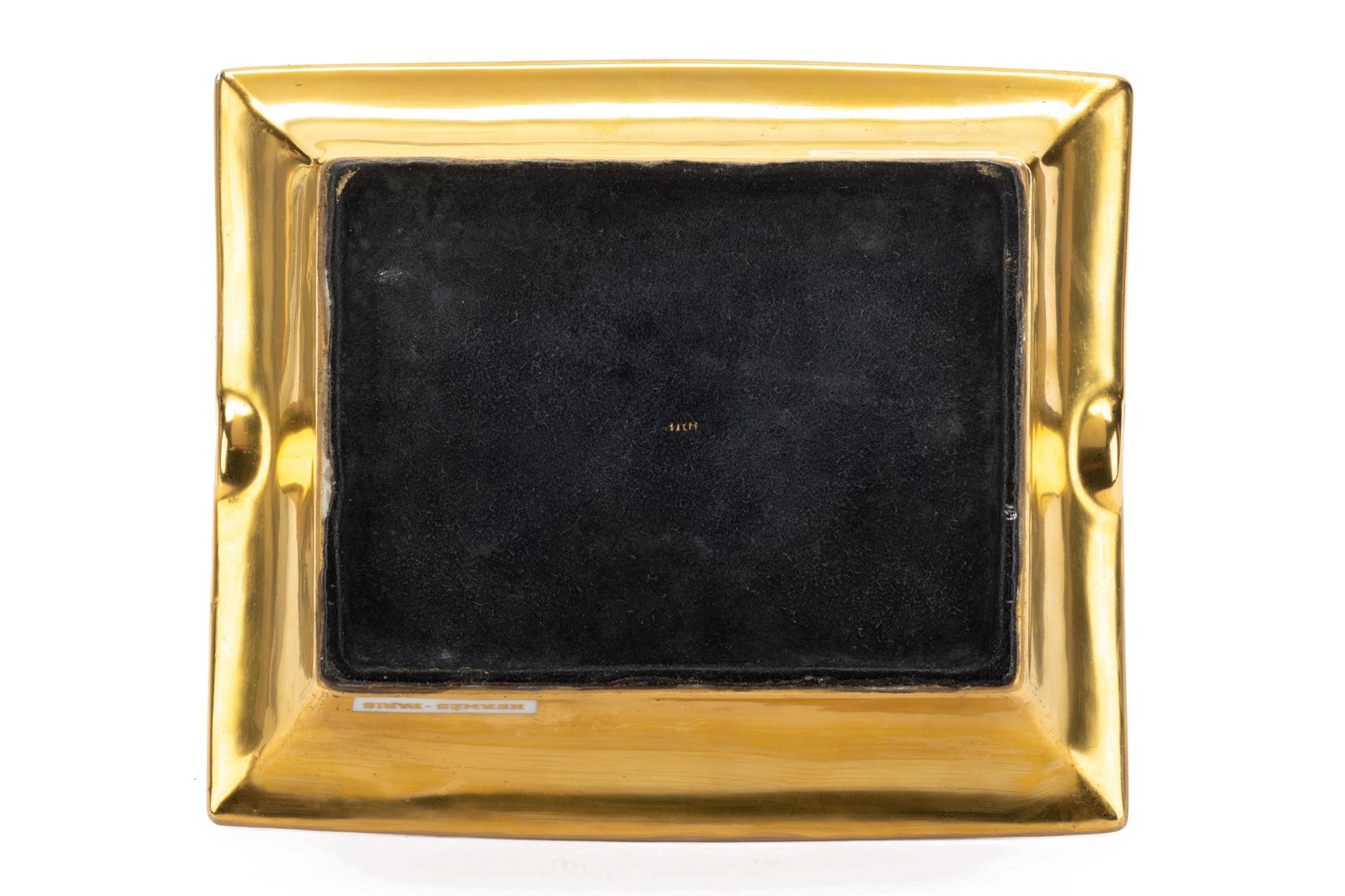 Hermes signature ashtray with samurai design in blue and gold. Suede stamped bottom. Minor wear on it. Made in France.