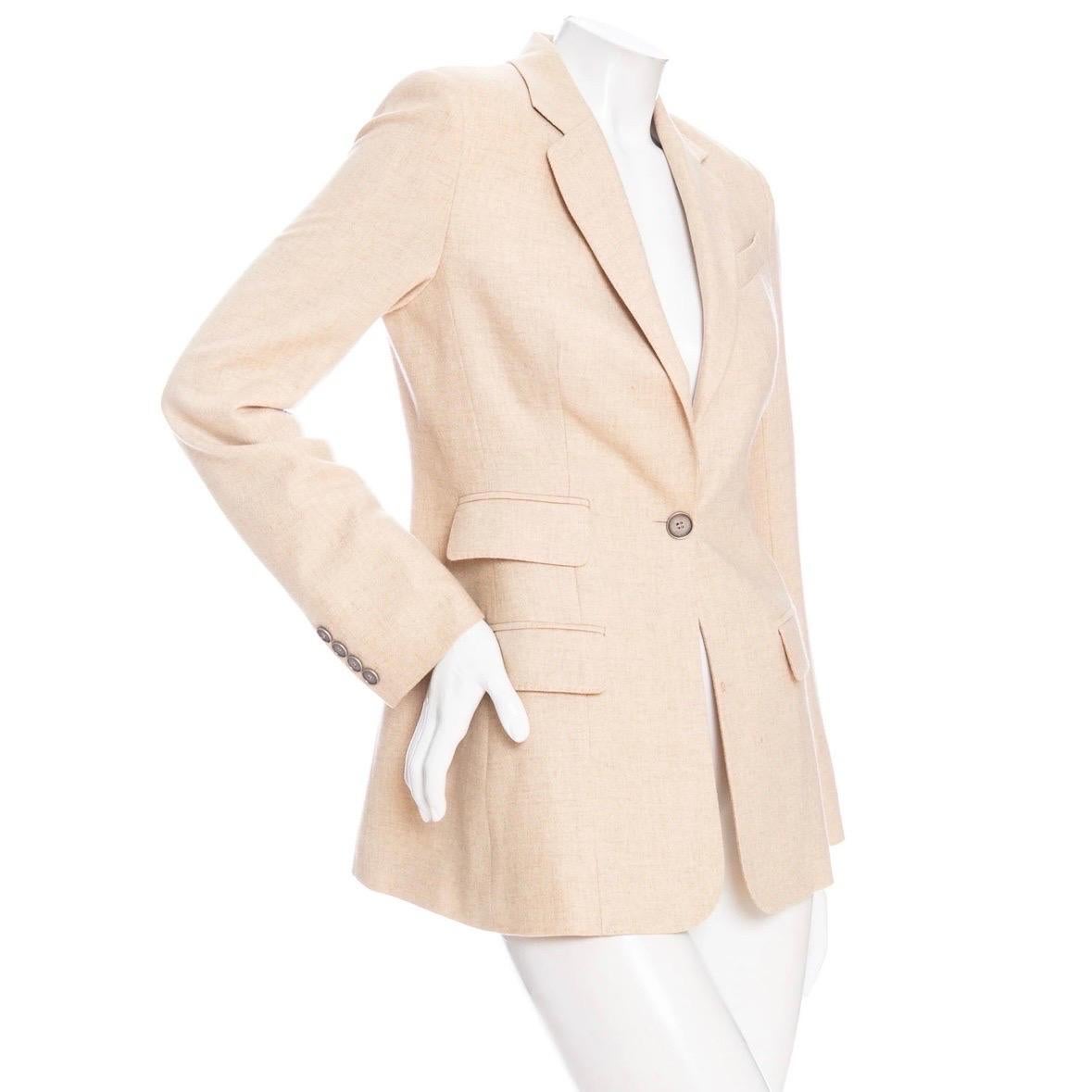 Hermès Sand Cashmere Single-Breasted Blazer 

Sand/Beige
Single-breasted
Button fastening
Notched collar
Asymmetrical front flap pockets
Cuff buttons
Jacquard lining
Fitted silhouette
Made in France
Good preowned condition; moderate staining in