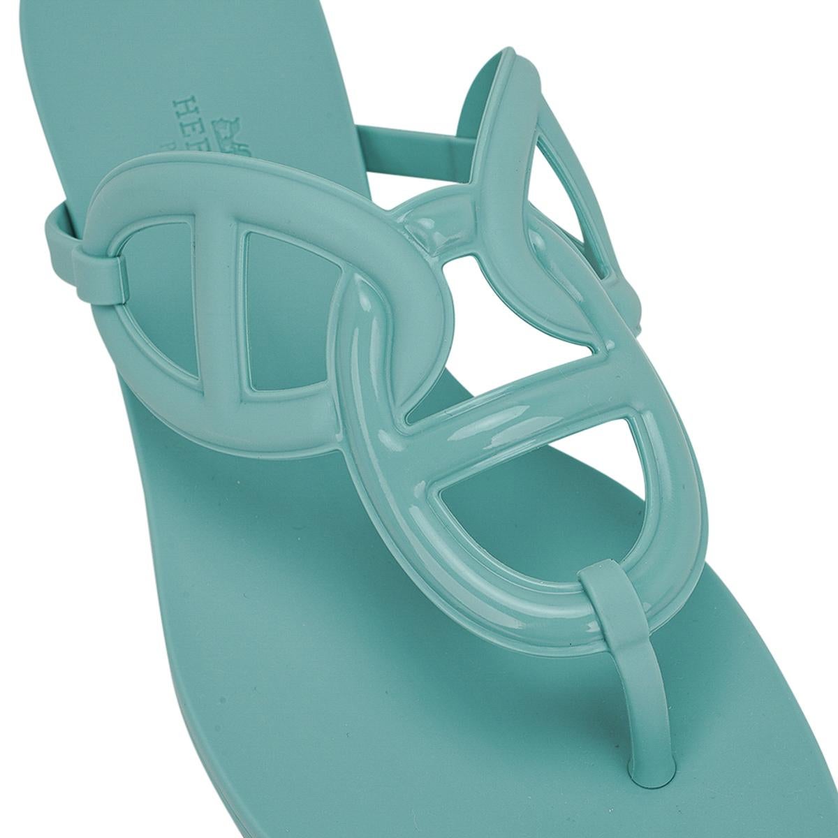 Mightychic offers limited edition Hermes Egerie waterproof sandals featured in Vert Embrun.
The thong sandal was inspired by the iconic Chaine d'Ancre motif.
Sold out and extremely difficult to procure.
Made from TPU, a PVC derivative, the sandal is