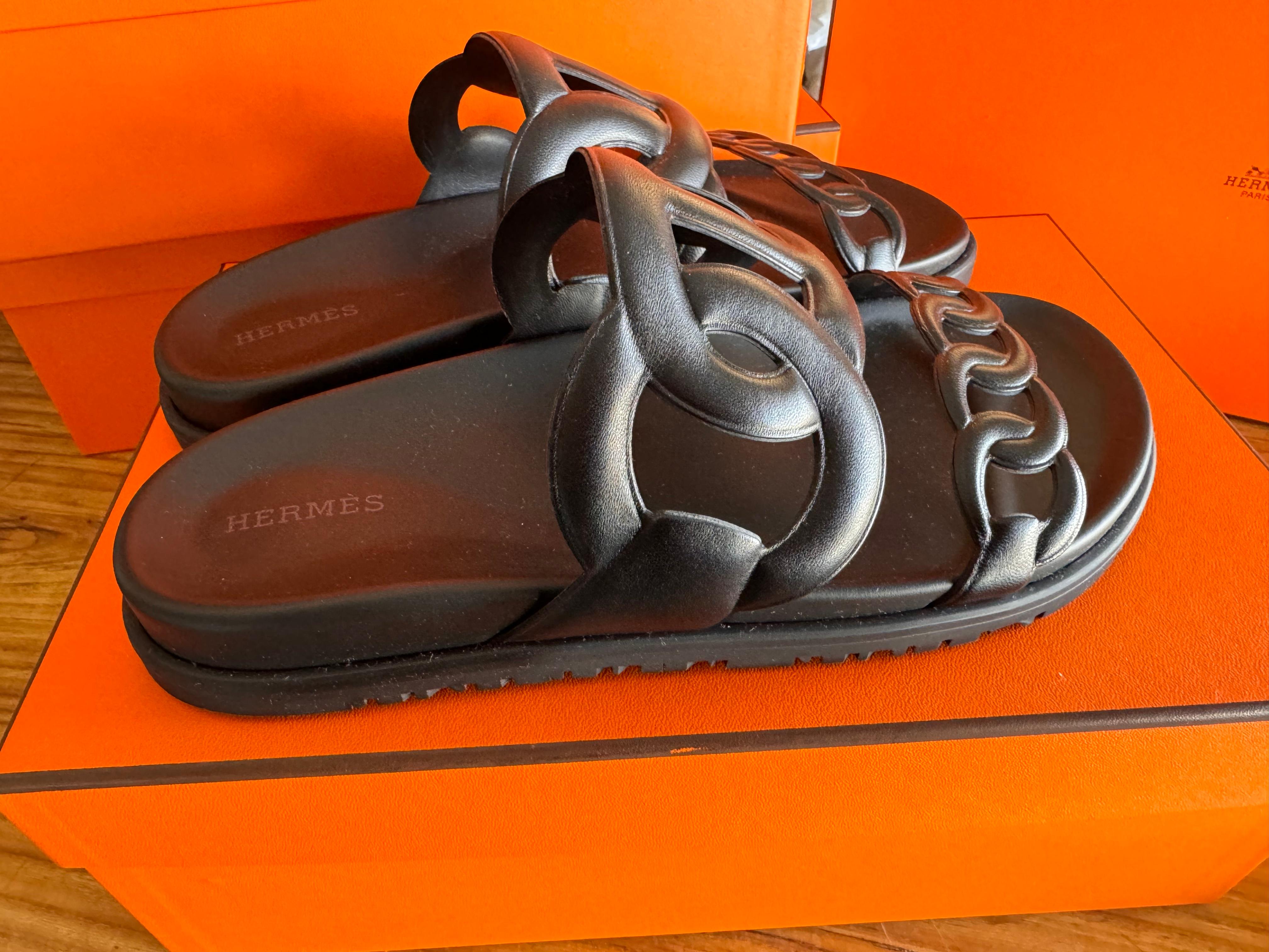 Elevate your footwear collection with the impeccable craftsmanship and timeless style of Hermes’ black kappa sandals Extra, now available in size 39 and presented in their original box complete with a dust bag for storage. Designed to effortlessly