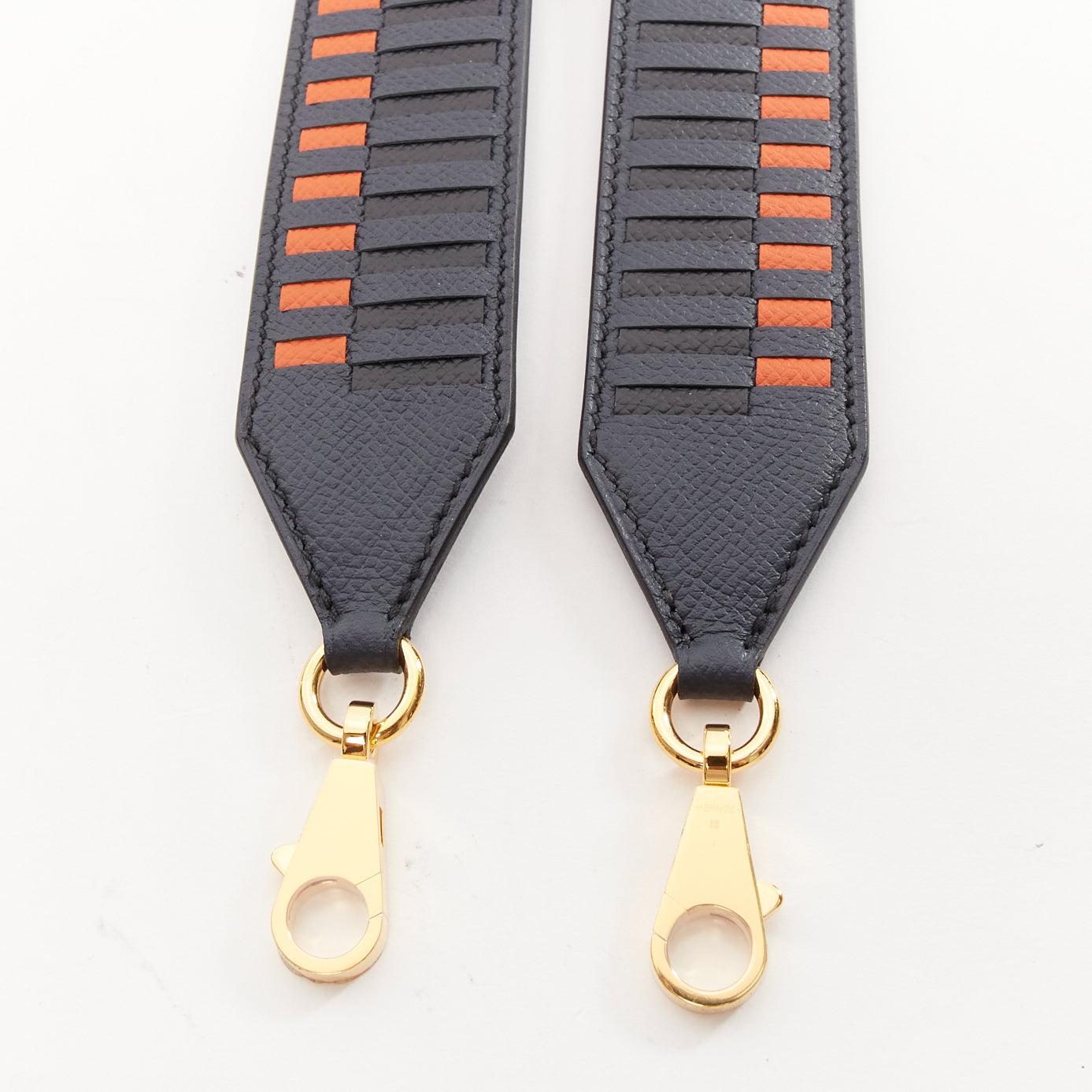 HERMES Sangle 40 orange navy woven leather gold hardware bag strap
Reference: AAWC/A01188
Brand: Hermes
Model: Sangle 40
Material: Leather
Color: Black, Orange
Pattern: Solid
Closure: Lobster Clasp
Lining: Black Leather
Made in: