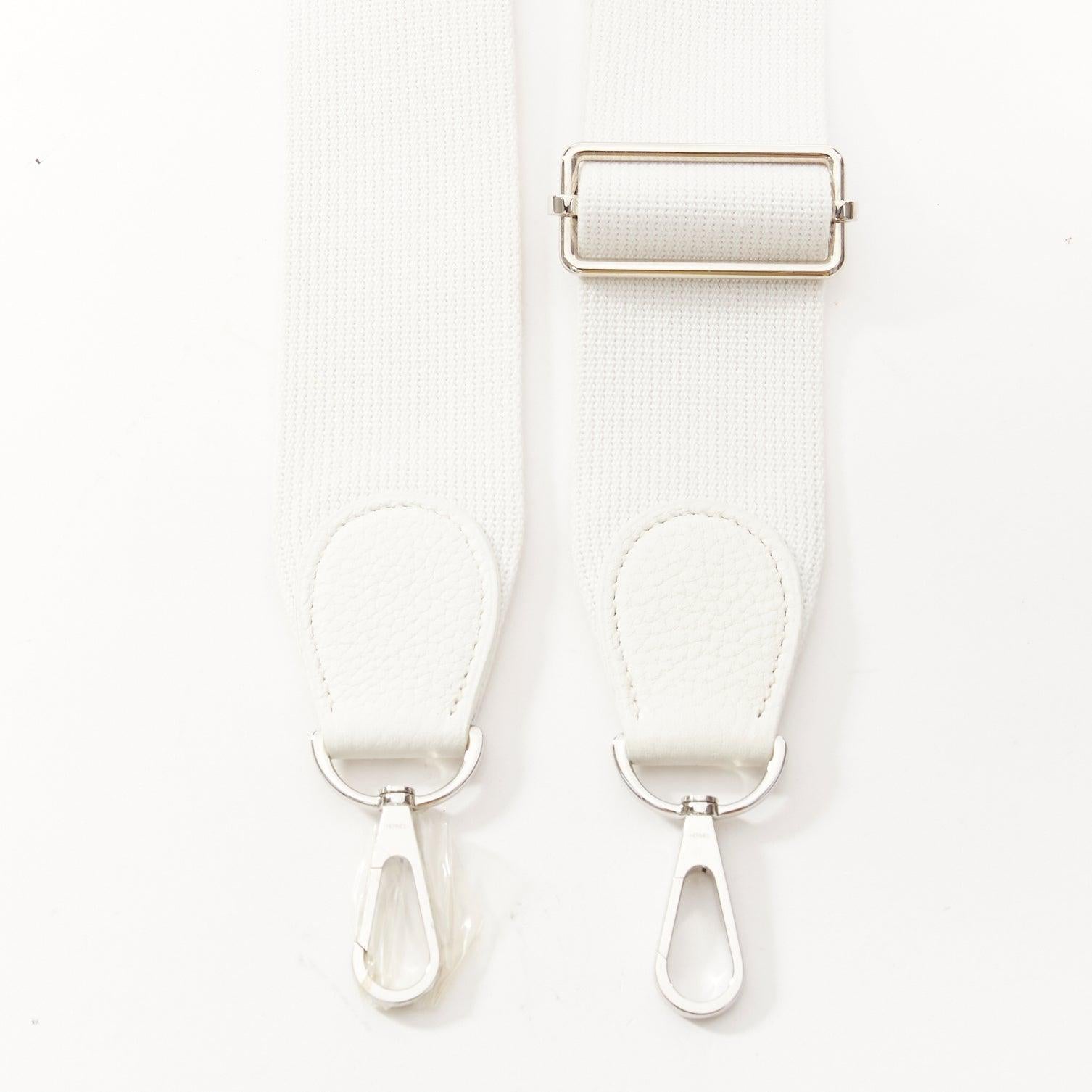 HERMES Sangle 50 white canvas leather silver hardware wide long bag strap
Reference: AAWC/A01181
Brand: Hermes
Model: Sangle 50
Material: Canvas
Color: White, Silver
Pattern: Solid
Closure: Lobster Clasp
Lining: White Canvas
Made in: