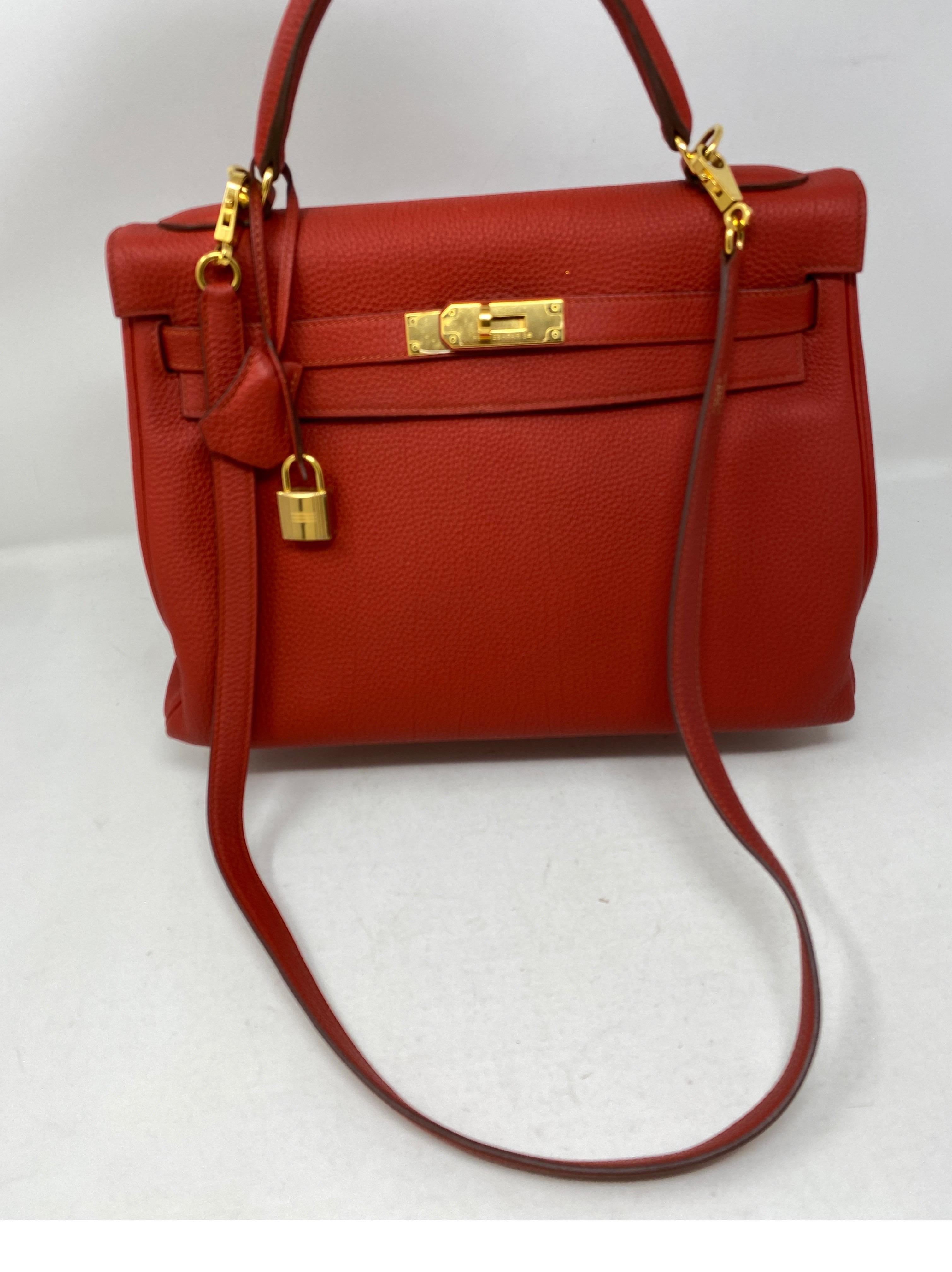 Hermes Sanguine Kelly 32 Bag. Deep red color with gold hardware. Beautiful color. Good condition. Togo leather. Includes clochette, lock, keys and dust cover. Guaranteed authentic. 