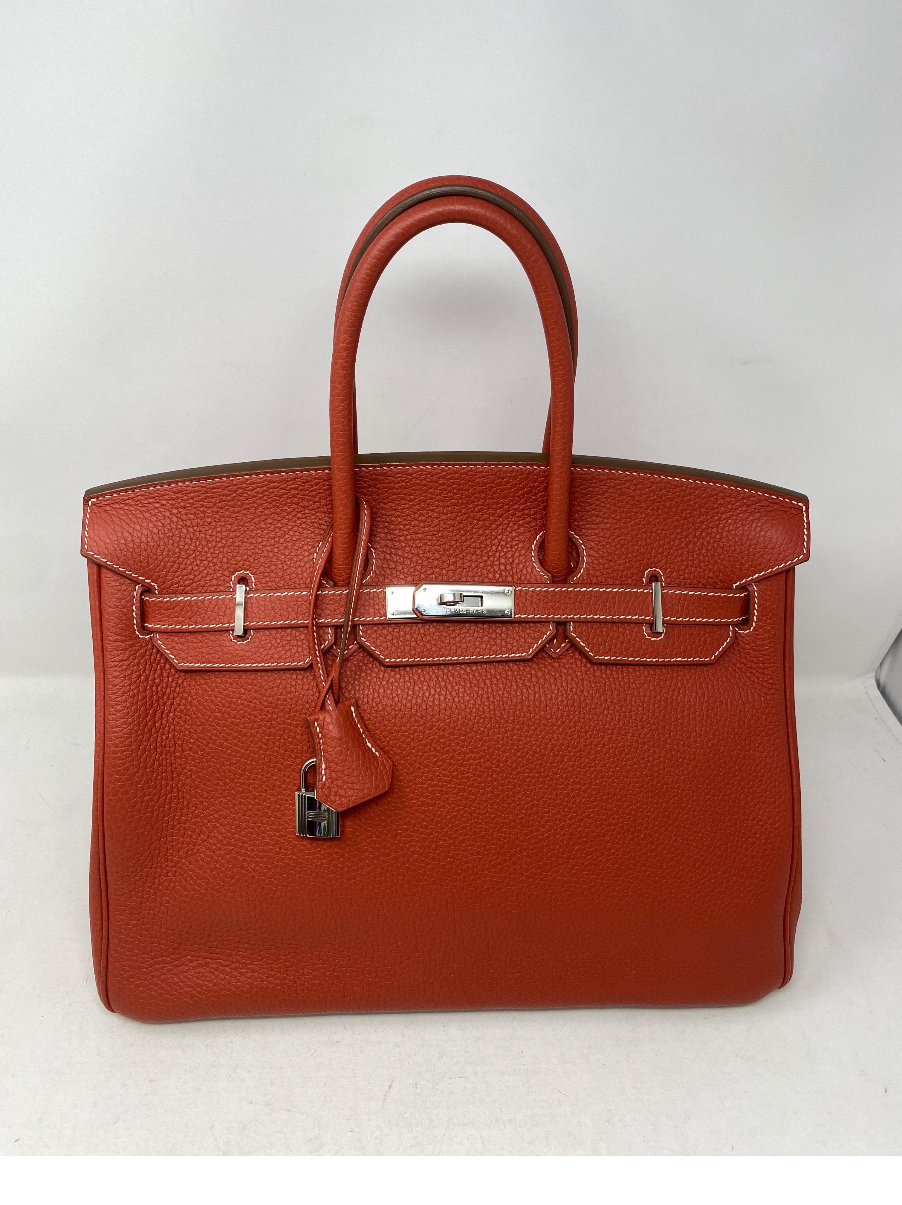 Hermes Sanguine Two Tone Birkin 35 Bag. Stunning sanguine red/ brick color with white interior. White leather on bottom. White contrast stitching. Excellent condition. Like new. Rare and limited edition. Palladium hardware. Plastic still on