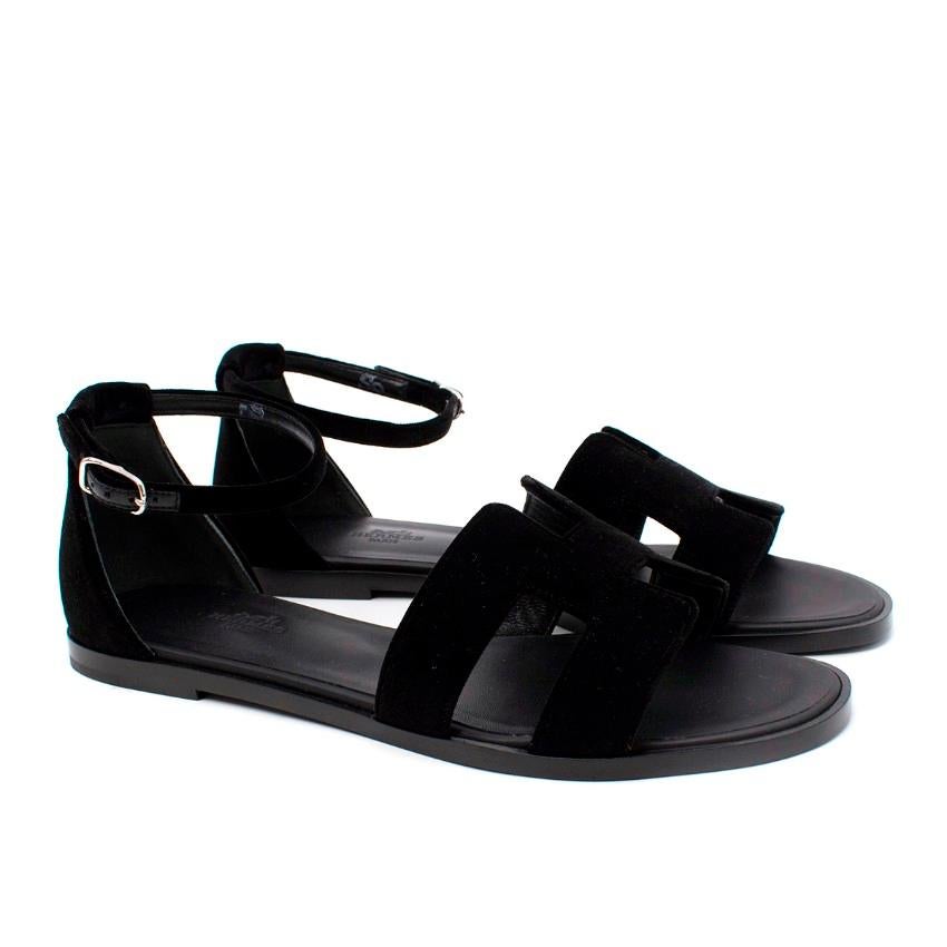 Hermes Santorini Black Velour Ankle Strap Flat Sandal
 

 - Classically elegant black velour Santorini sandal, featuring iconic 'H' foot strap, and narrow velvet ankle strap and heel support
 - Silver-tone adjustable buckle
 - Leather lined footbed,