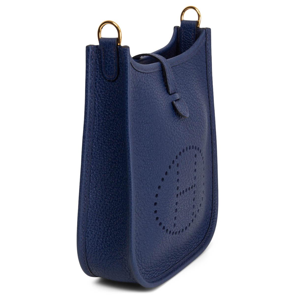 100% authentic Hermès Evelyne 16 Amazone crossbody bag in Bleu Saphir (sapphire blue) Taurillon Maurice leather with wool sangle Flipper Ball shoulder strap in blue, black and tan canvas. Perforated leather 