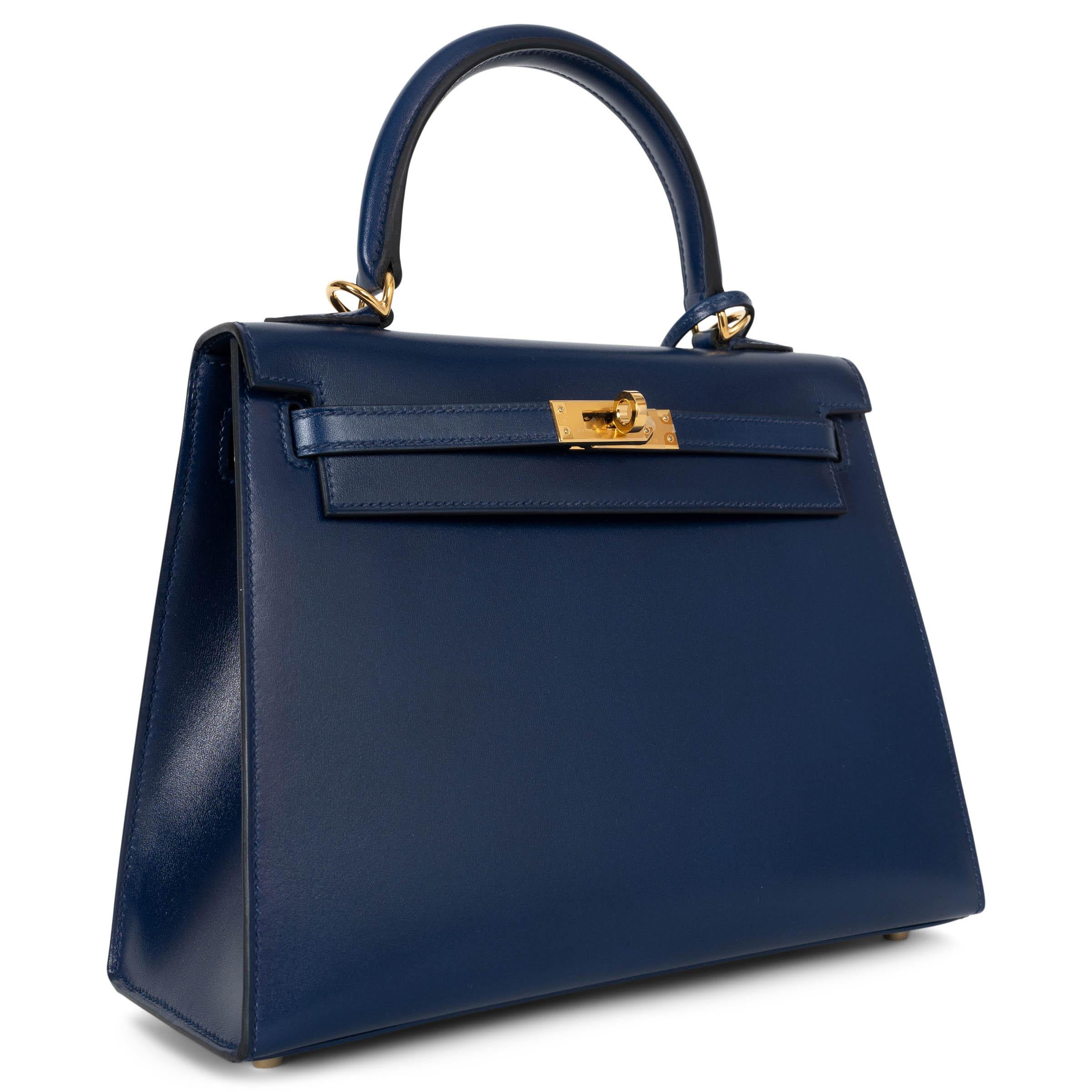 This 100% authentic Hermès Kelly 25 Sellier bag in Bleu Saphir (Sapphire Blue) Veau Box leather is a rare classic, celebrated for its sleek, structured silhouette and luminous sheen. Crafted from Box leather, one of Hermès' most coveted and timeless