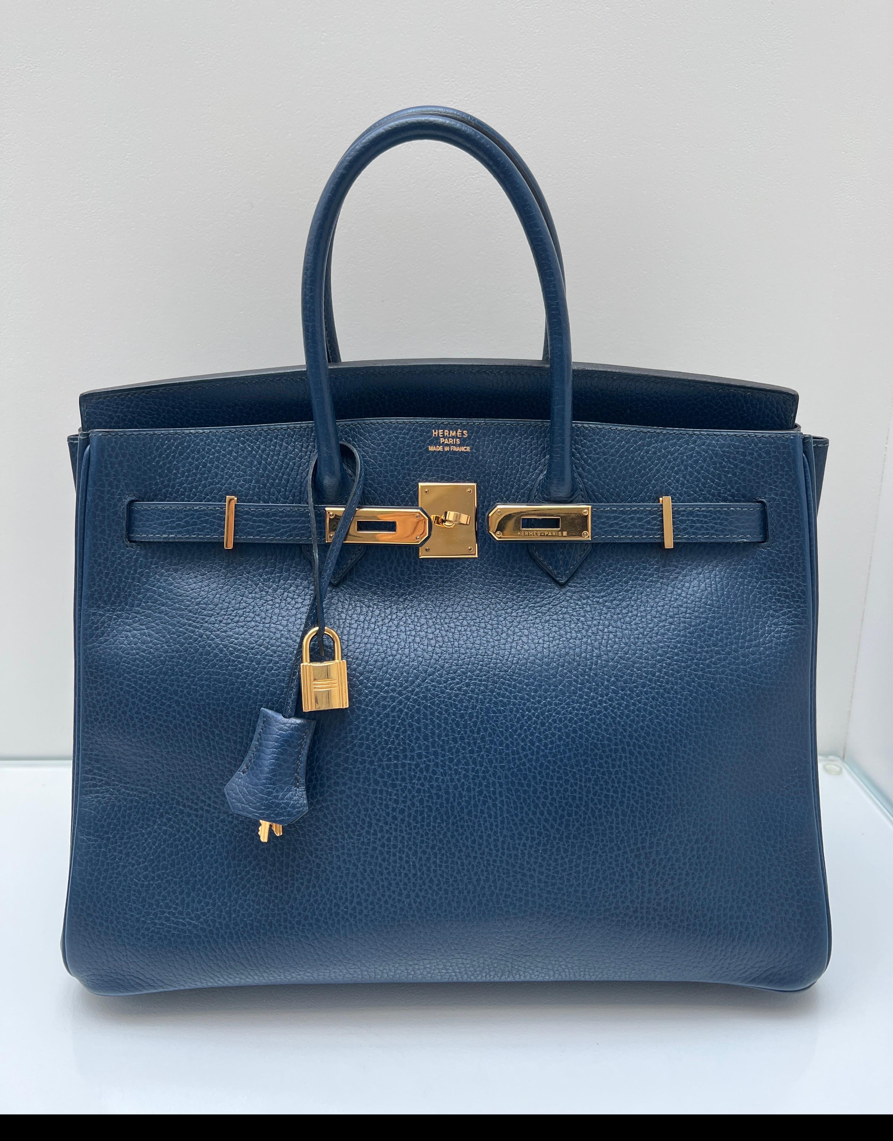 Hermes Blue Sapphire Birkin 35 Bag. Beautiful navy tone blue color with gold hardware. Vintage ardennes leather in good condition. Great condition for a vintage bag. Ardennes is no longer available at Hermes. It is a collector's piece. Interior