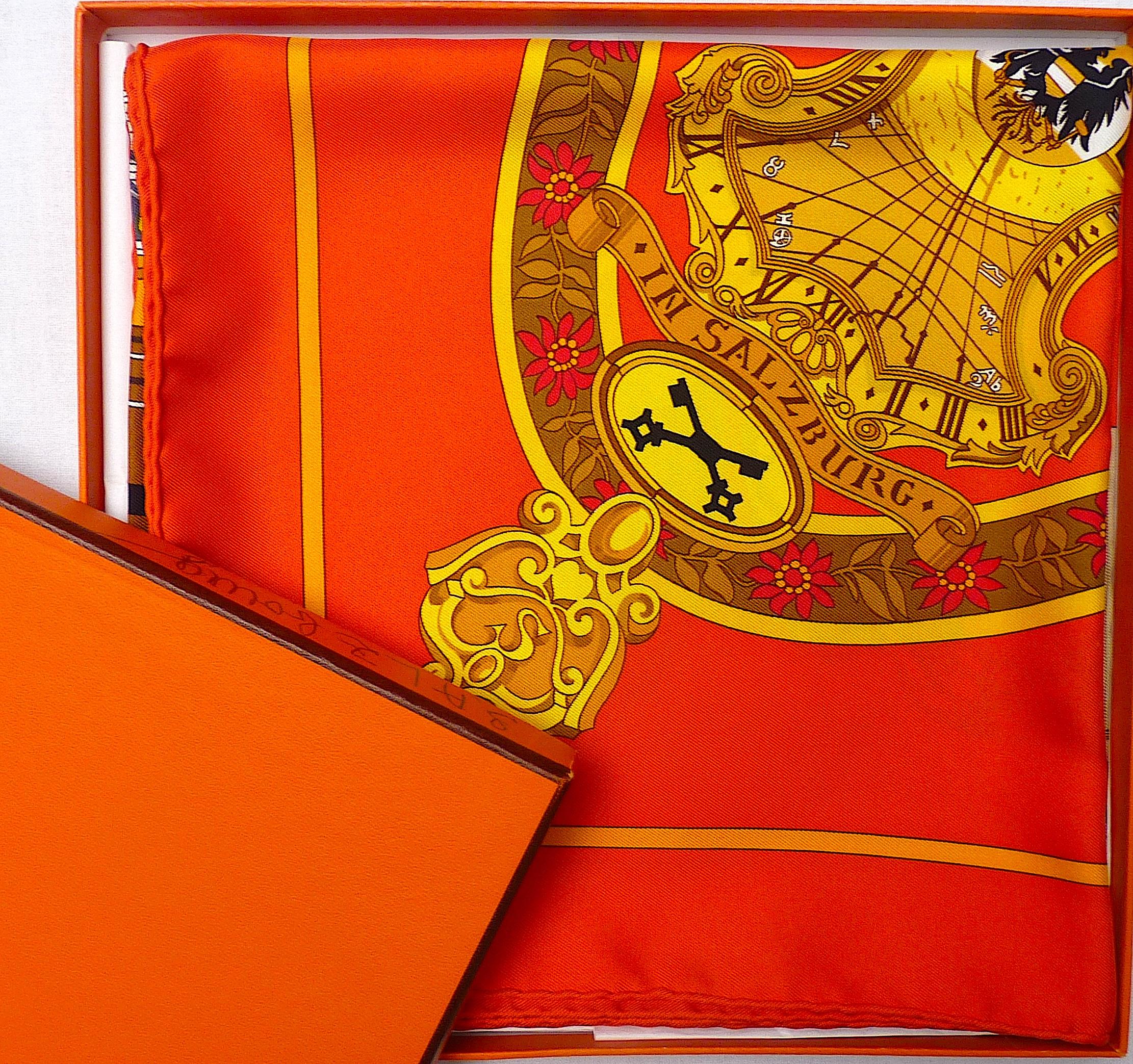 Magnifique Foulard HERMES en soie 35 X 35 pouces NEUF dans sa boîte, intitulé Salzburg, dessiné par Loïc Dubigeon dans les années 90, dans un orange vibrant.
Un bel hommage à Mozart, à sa ville natale et à sa très célèbre Zauber Flöte

Étiquette