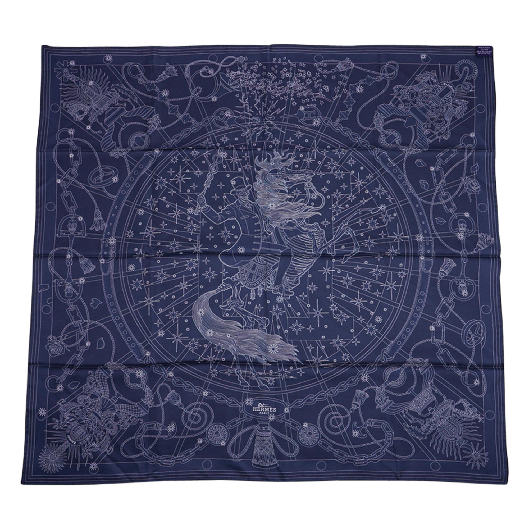 Guaranteed authentic Hermes C'est La Fete Double Face Silk Twill scarf by Daiske Nomura.  
In shades of blue, gray and plum, with a border of blue.
Features a skeleton riding a skeleton horse amid a burst of stars.
A large subtle H in the