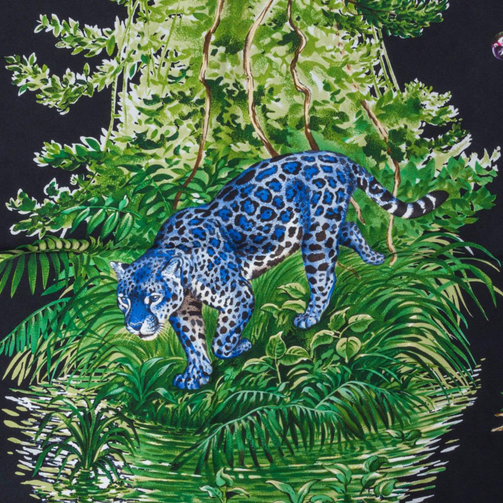 Guaranteed authentic Hermes Equateur Wash Silk Twill scarf by Robert Dallet.  
Dramatic Noir, Vert and Bleu depicts equatorial animals, birds and plants.
This was silk has a velvety feel with a matte ever so slightly faded finish.
Incredibly soft to
