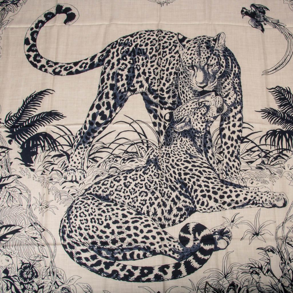 Mightychic offers a limited edition Hermes Jungle Love Tattoo Cashmere and Silk scarf by Robert Dallet.  
This picture of love depicts 2 amorous leopards in their natural habitat.
Designed by Robert Dallet who worked as a naturalist for the National