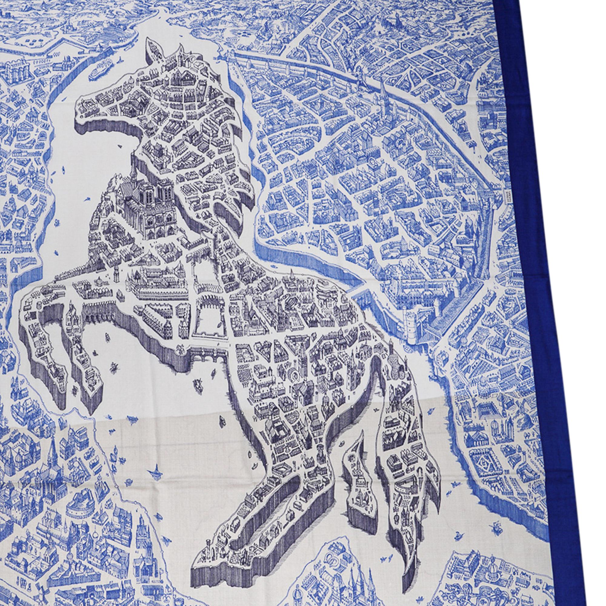 Hermes La Cite Cavaliere Cashmere and Silk scarf by Octave Marsal.
Depicts a bird's eye view of Paris with the horse at its heart!
Exquisite in Bleu Royal, Blanc and Bleu Encre.
Signature hand rolled edge.
Comes with signature Hermes Box and