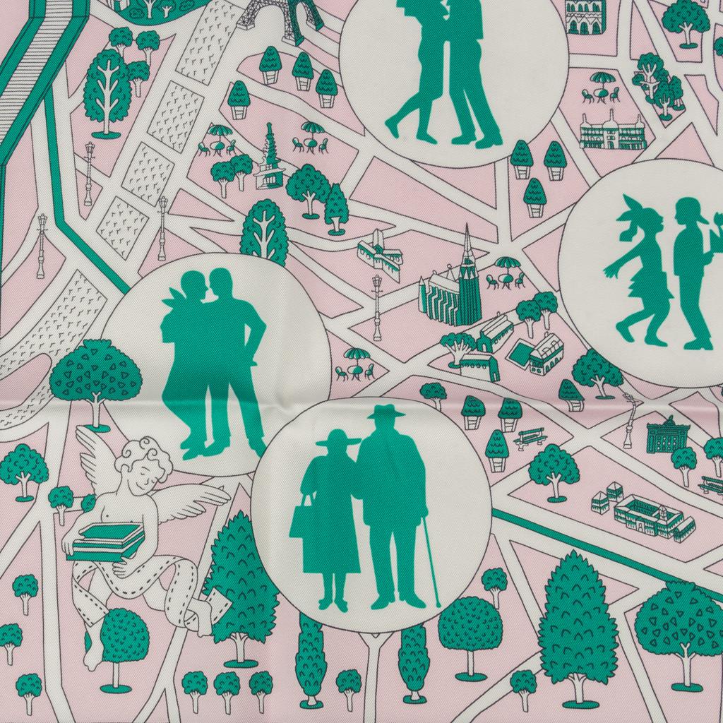 Guaranteed authentic Hermes Les Nouveaux Amoureux De Paris Silk Twill scarf by Perre Marie.  
This is a new interpretation of the 1950s design by Maurice Tranchant. 
Couple silhouette against a map of the City Of Light. 
A couple jogging, a pair of