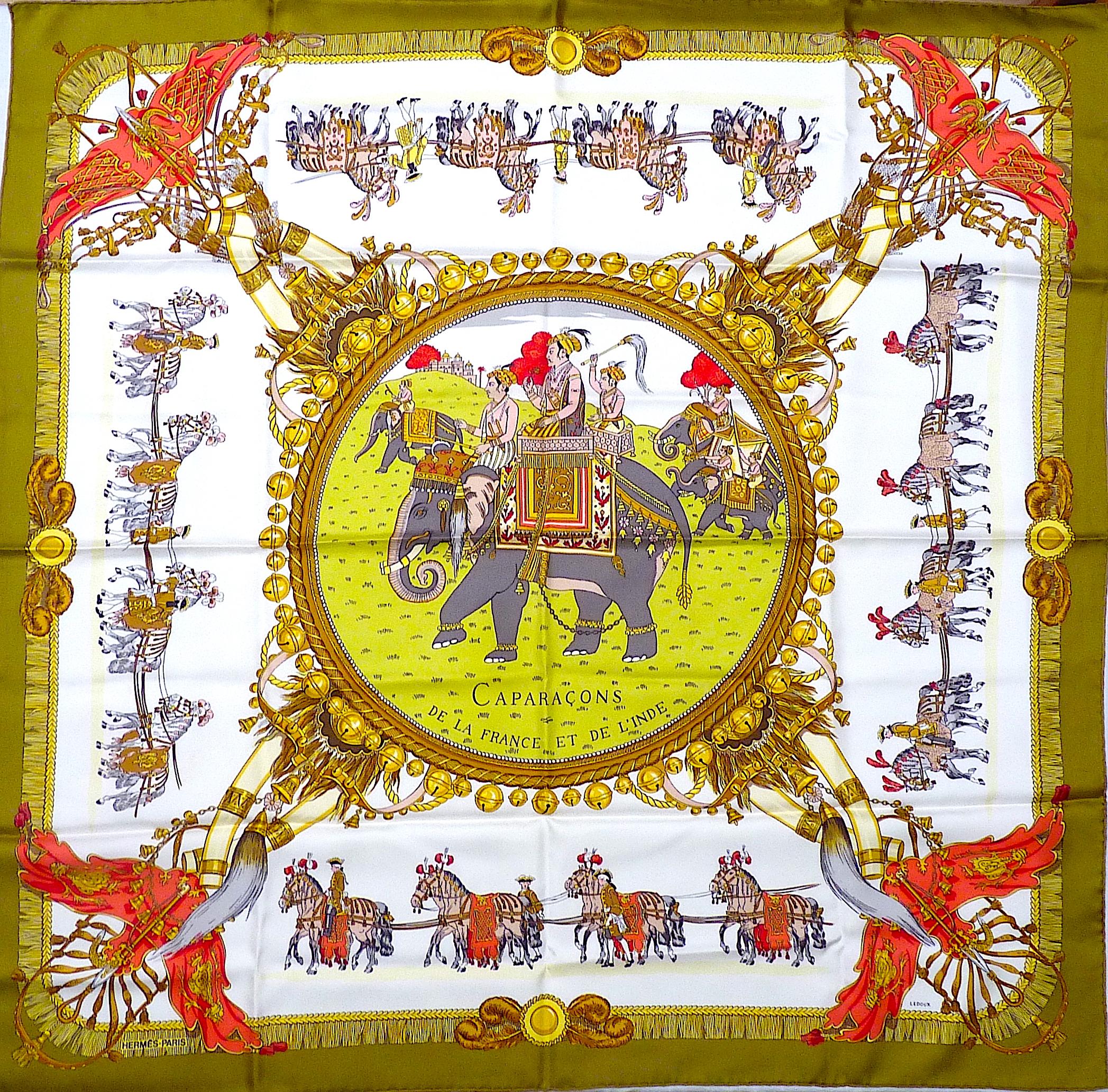 Lovely Hermes scarf model Caparaçons de la France et de l'Inde by Ledoux in 1956 and offered here in its re issue of 1997. Very sought after by Hermes Collectors !
Lovely palette of Bronze Green, Red and Gold with blanc matt overlay on a few parts