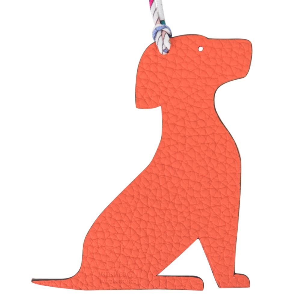 Guaranteed authentic rare Hermes bag charm features the coveted Seated Dog Petit h Bi-Color.
One side of this whimsical charm comes in Blue Epsom, the other in Orange Togo and will add a delightful touch to a myriad of your bags! 
Twill silk printed