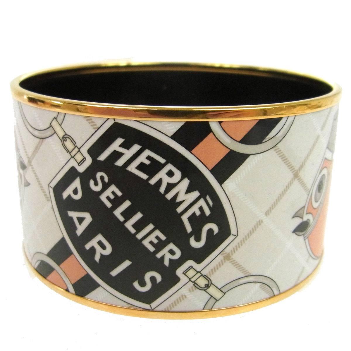 Hermes Sellier Horse Motif Paris Wide Gold Evening Cuff Bracelet in Box

Metal
Enamel
Gold tone 
Date code present 
Made in France
Width 1.5