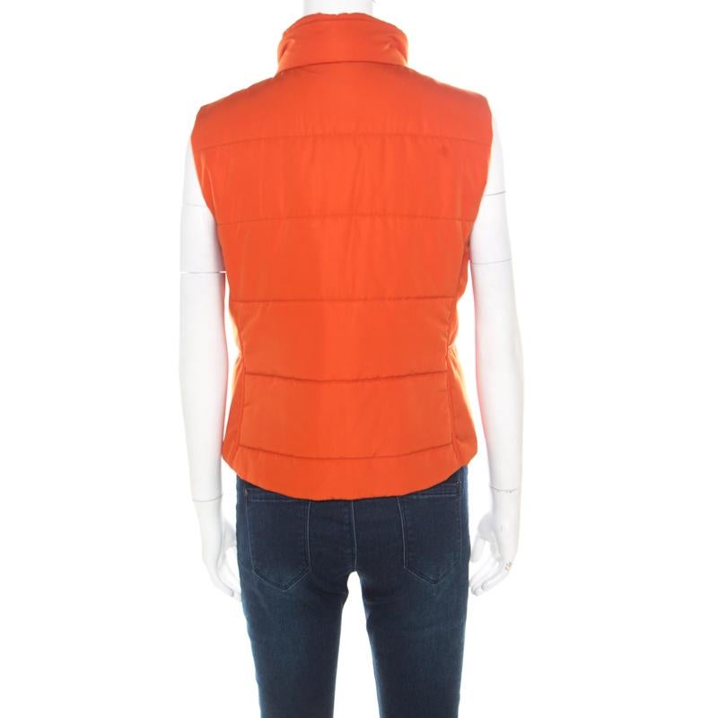 Tailored to perfection is this exclusive and classy vest from the house of Hermes. Orange in color, this would take your style game to a whole new level. It is designed in a sleeveless style with a zip closure on the front, a quilted pattern all