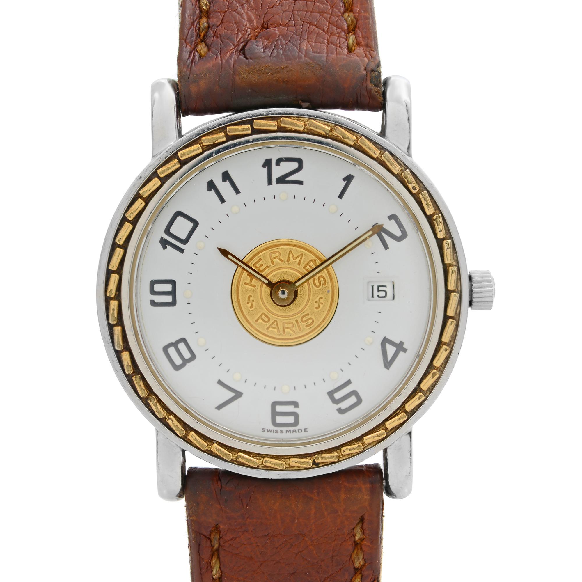 Pre Owned Hermès Sellier Stainless Steel White Dial Brown Leather Strap Quartz Watch. The back case is approx Polished OFff except Serial nothing is visible. Heavy dings on Back Case edges during battery change. Strap have visible wear signs and