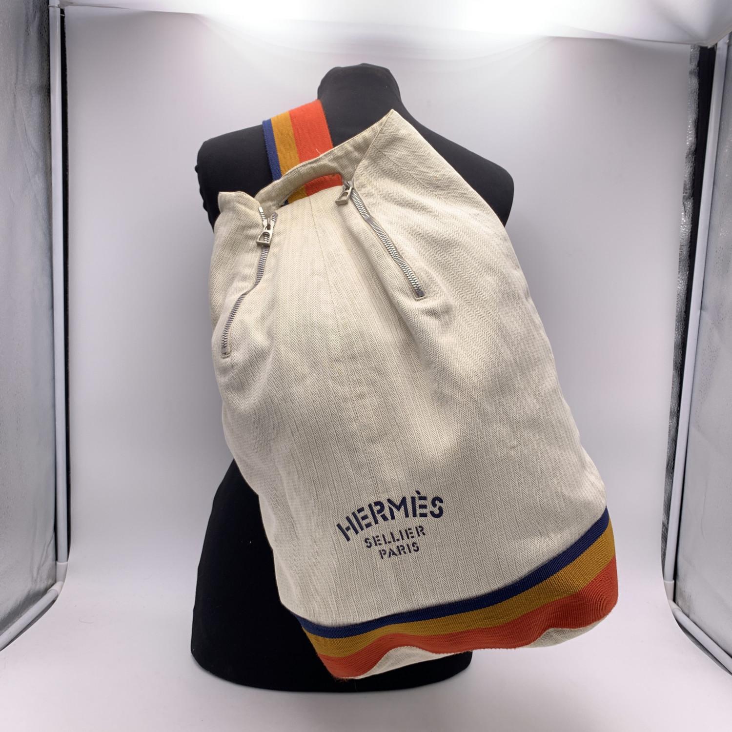 Hermes Sellier Vintage beige cotton canvas Summer beach bag. Multicolored trim and strap. 'Hermes Sellier Paris' printed on the front. 2 zip on top. 'Hermes Paris - Made in France' tag inside.

Details

MATERIAL: Cotton

COLOR: Beige

MODEL: