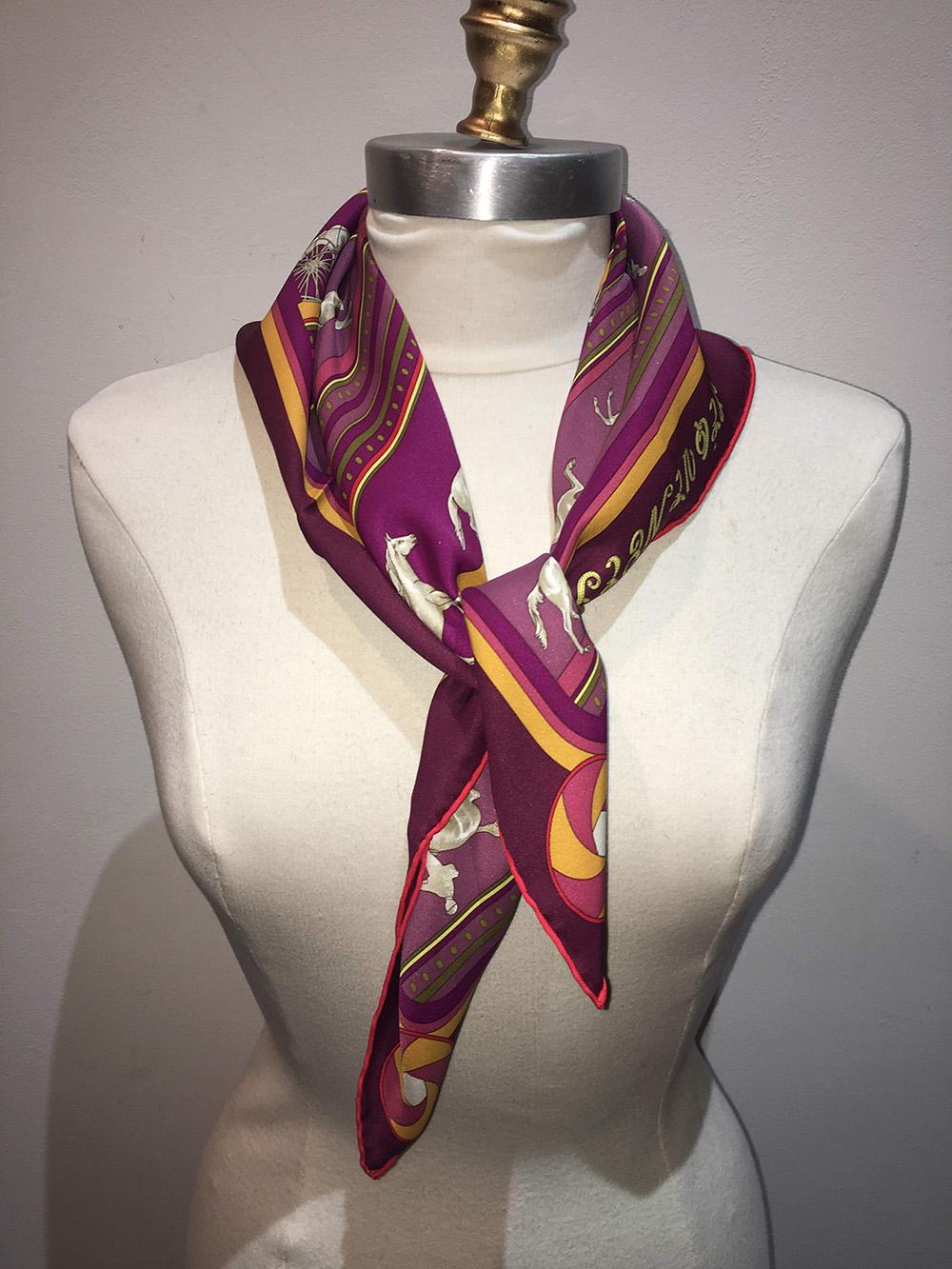Hermes Sequences Maroon Silk Bandana Scarf 70 in excellent condition. Original silk screen design c1983 by Caty Latham features five various horse patterns over a maroon background with pink, gold, purple and fuchsia stripes. 100% silk, hand rolled