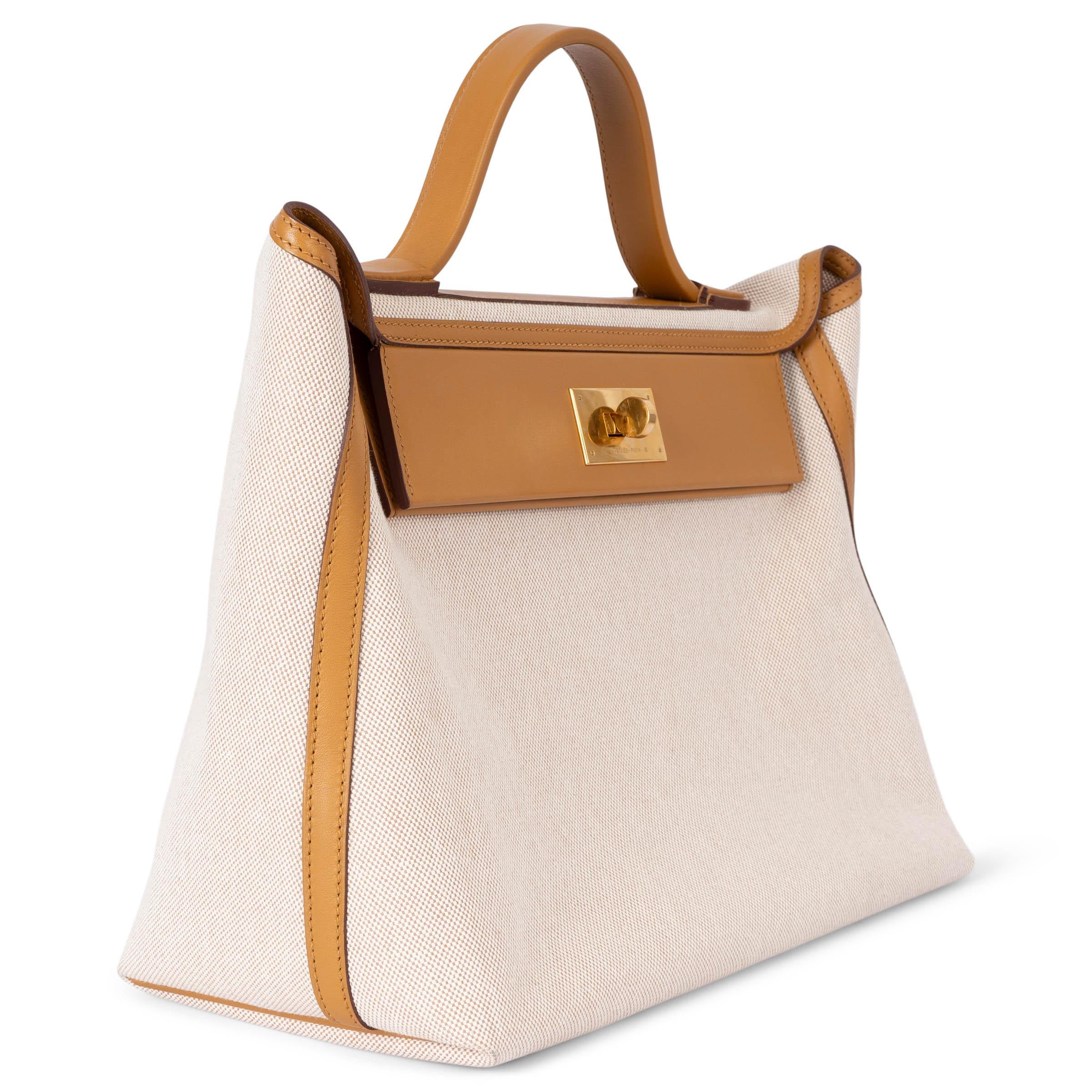 100% authentic Hermès 24/24-35 bag in ecru-beige Toile H Viking with Sesame (beige) Veau Swift leather trims. Features an open pocket on the outside back. Closes with a gold-plated turn lock on the front. Unlined with an open pocket in leather