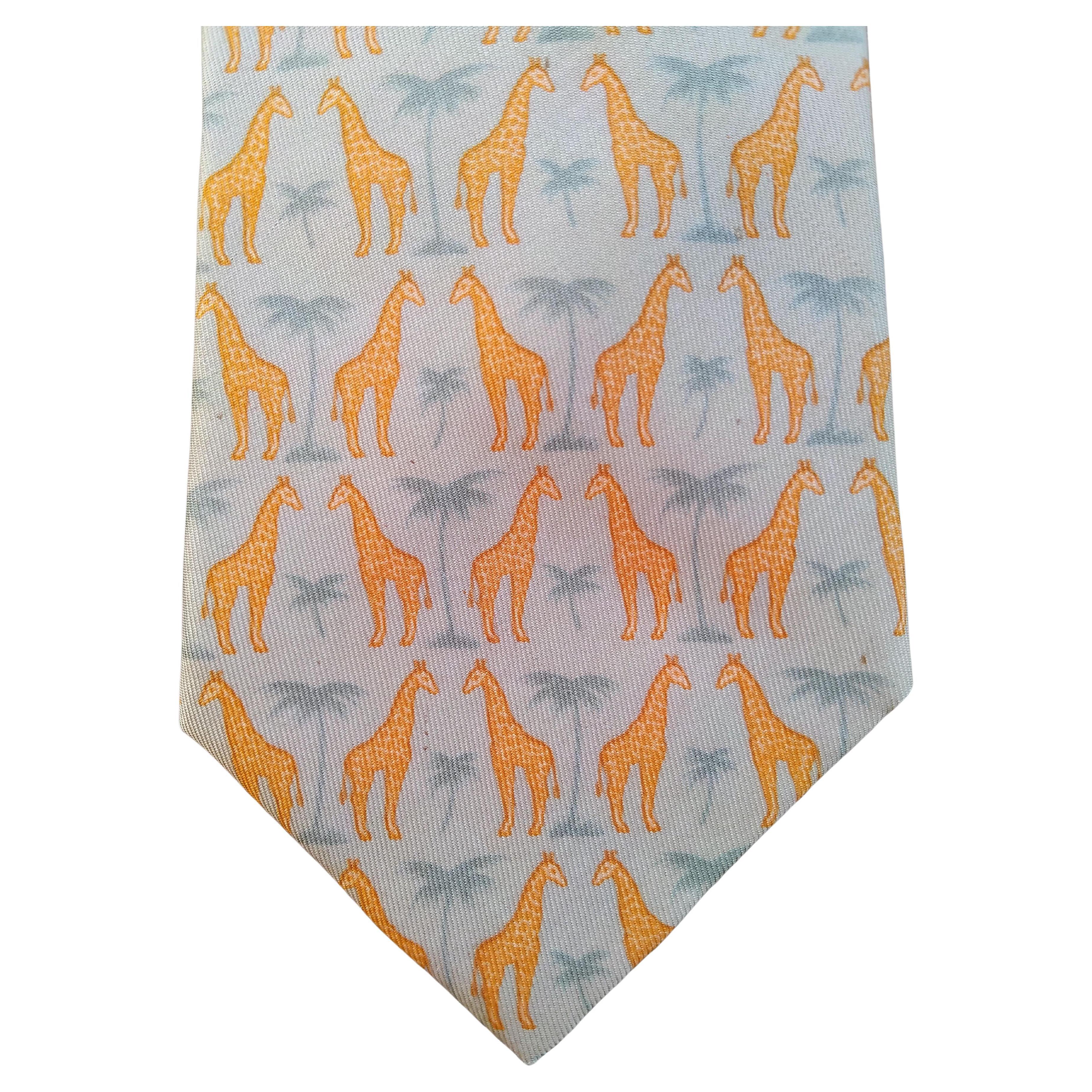 Lovely Authentic Hermès Ties

Prints: Giraffes and Camels

Made in France

Made of 100% silk

1. Giraffes print:
- Beige background, yellow giraffes and grey palm trees. 
- Lined with plain beige silk
- With care tag
- Serial number 7314 EA
- Around