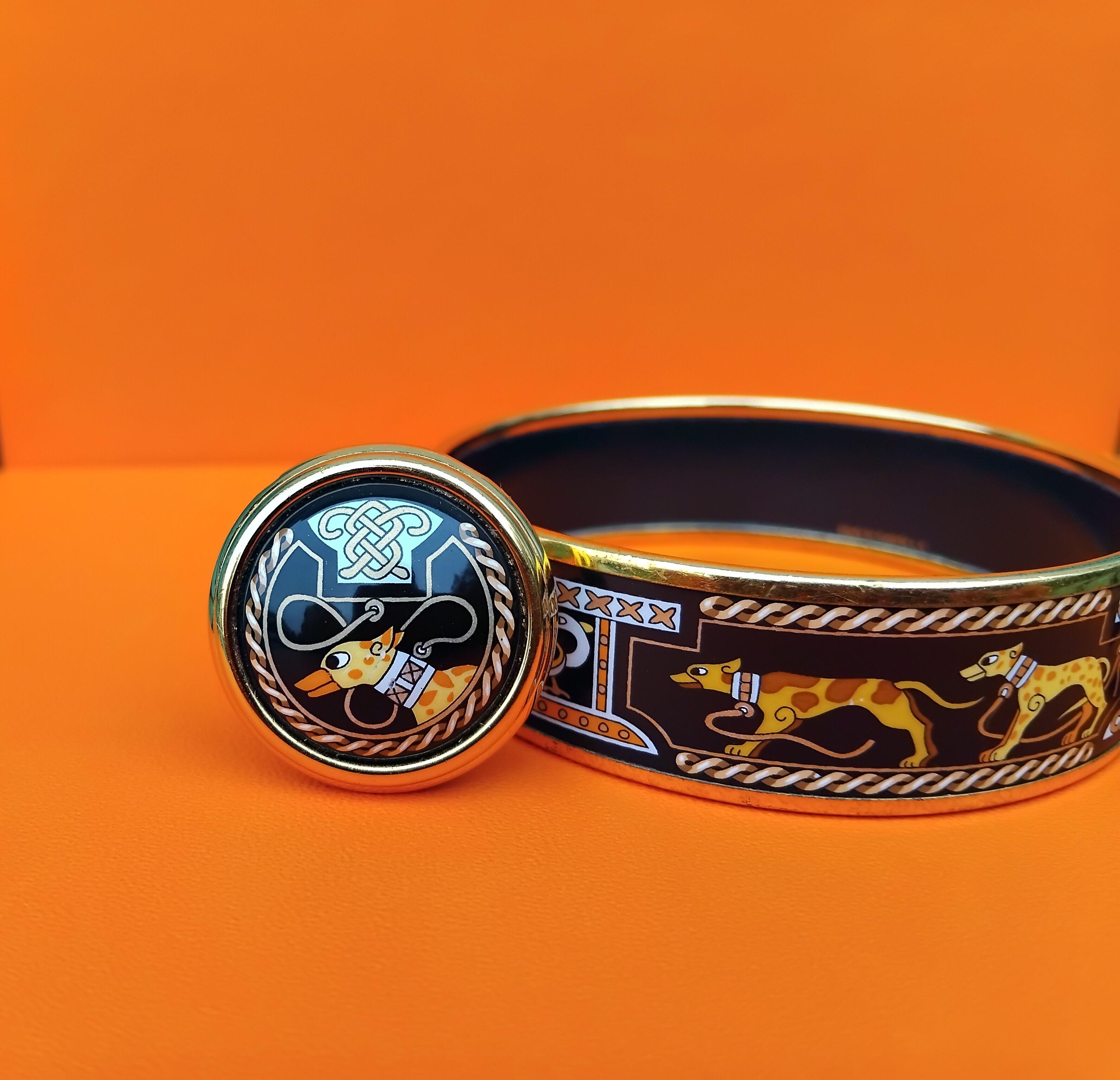 Rare Set of Authentic Hermès Bracelet and Earrings

Print: Lévriers (Greyhound dogs)

Set includes 1 bracelets and 2 clip-on earrings (fit pierced and non-pierced ears)

Made in Austria (+A for the bracelet)

Vintage, from 1997

Made of printed