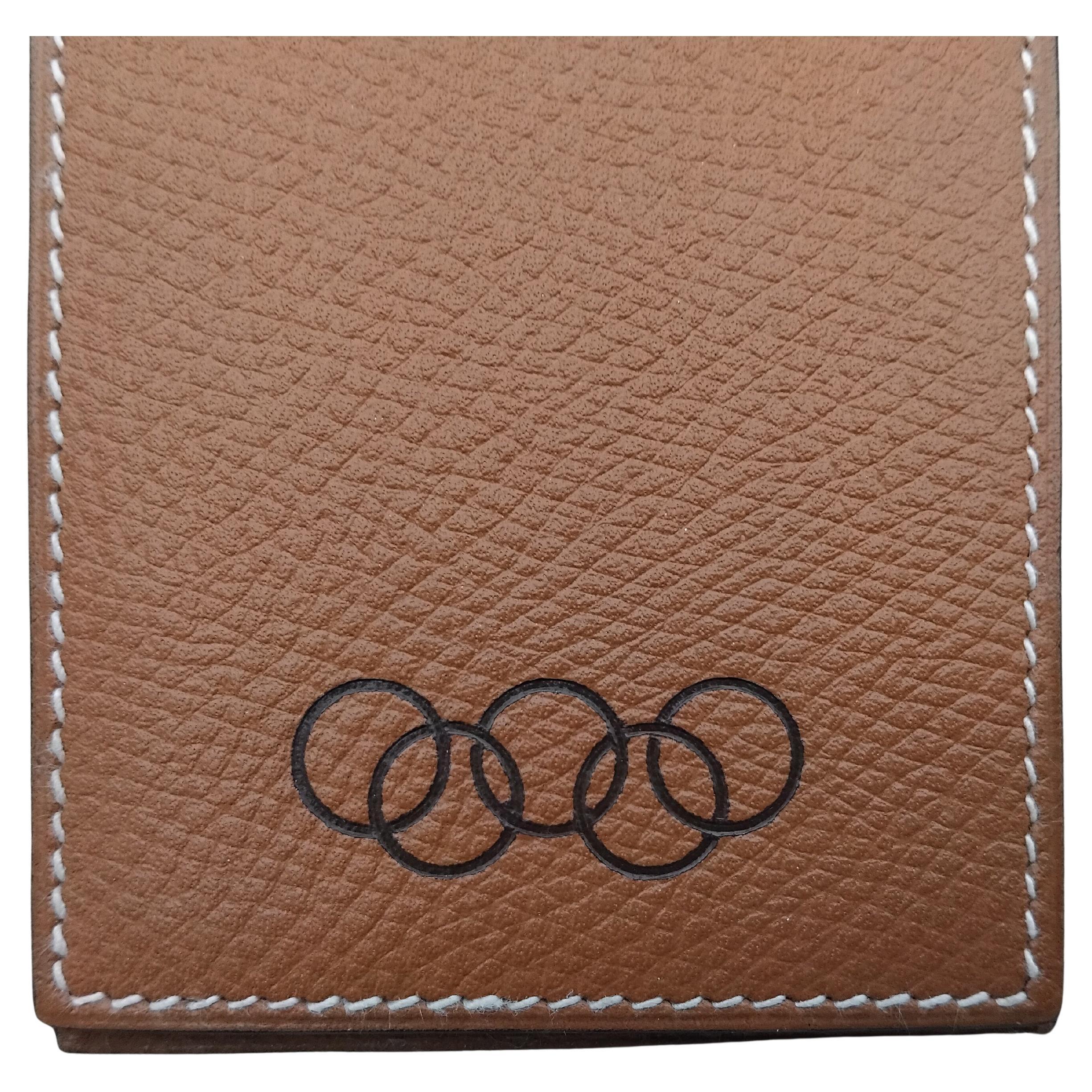 Exceptional and Rare Authentic Hermès Notepad

Set including 2 Hermès notepads and their Hermès cover

Cover is made of gold epsom leather, white stitching, black Olympics logo in front. Back is plain. 