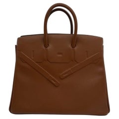 Sac Birkin 25 « Hermes Shadow » en cuir Swift doré, édition limitée, pièce rare, 2021