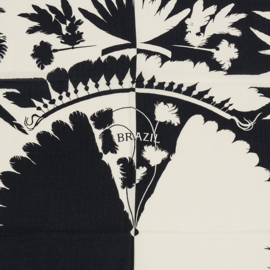 Guaranteed authentic Hermes Brazil Tattoo Cashmere Silk 140 shawl. 
Rich Bleu Noir and Blanc shawl is dramatic and a very wearable combination.
Signature hand rolled edge. 
Beautiful composition designed by Laurence Bourthoumieux features the use of