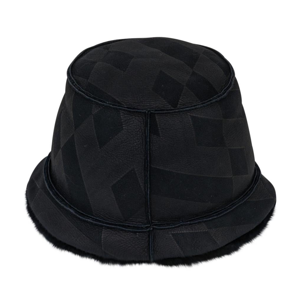 Mightychic offers an Hermes Black Shearling bucket hat. 
Lambskin with stamped abstract black on black design and Shearling inside.
Hermes tag inside.
Fabulous, rare to find beauty!
NEW or NEVER WORN
final sale

HAT SIZE 
59

CONDITION:
NEW or NEVER