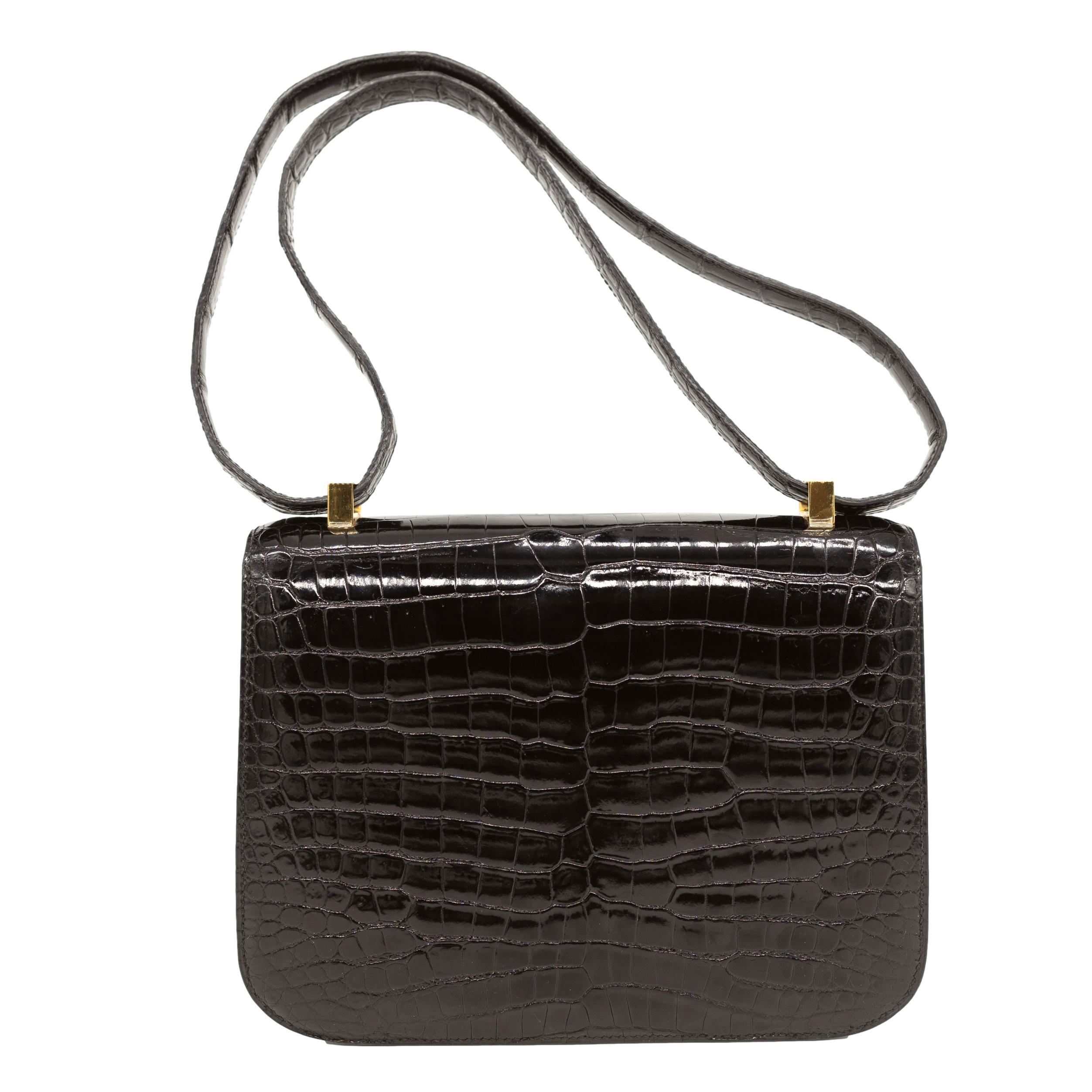 Women's or Men's Hermès Shiny Black Porosus Crocodile 23cm Constance Bag with Gold Hardware, 2001 For Sale