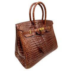 Hermès Shiny Miel Porosus Crocodile 35cm Birkin Bag with Gold Hardware, 2008.