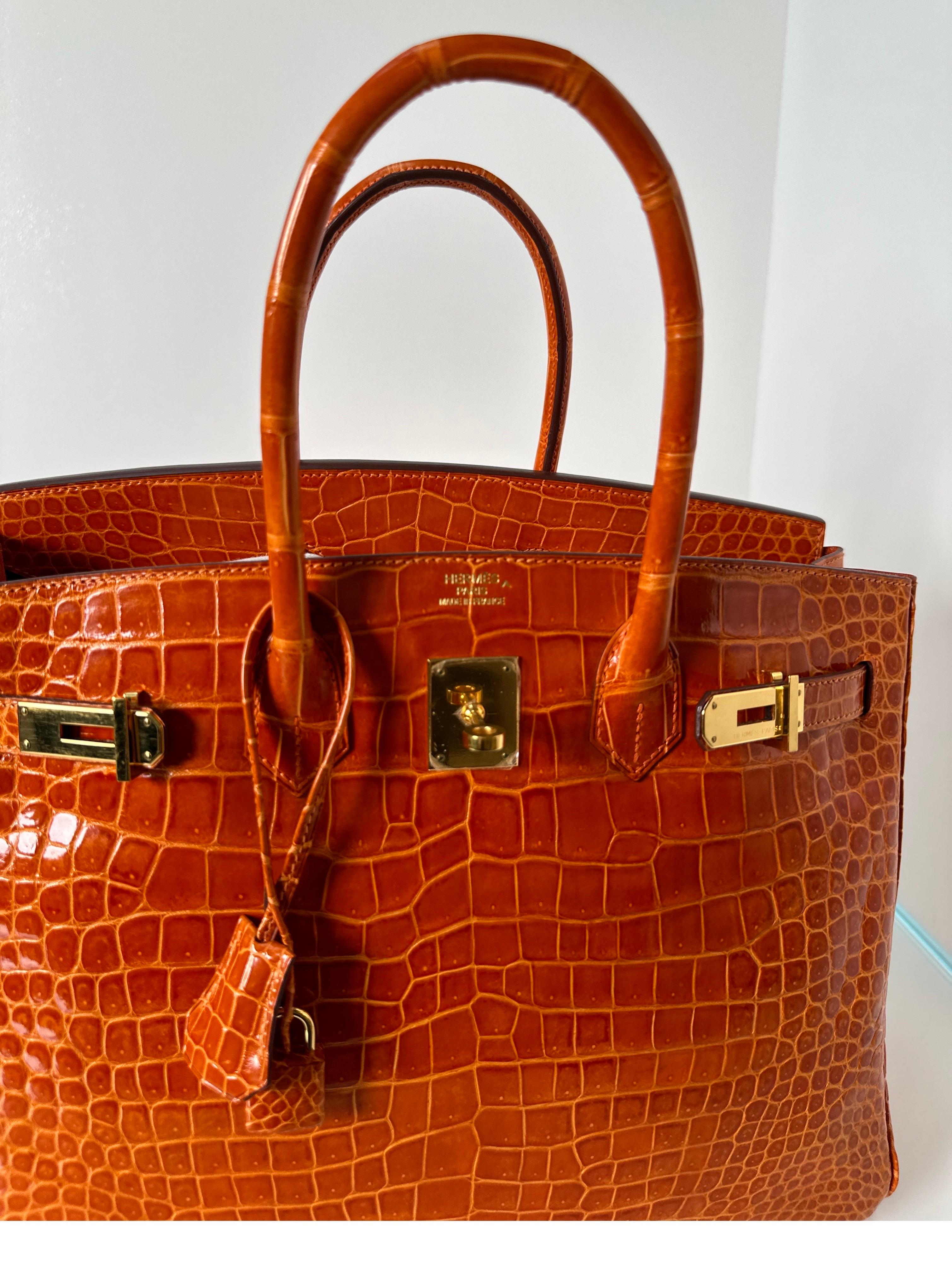 Hermes Shiny Porosus Crocodile Orange Birkin 35 Bag In Excellent Condition In Athens, GA