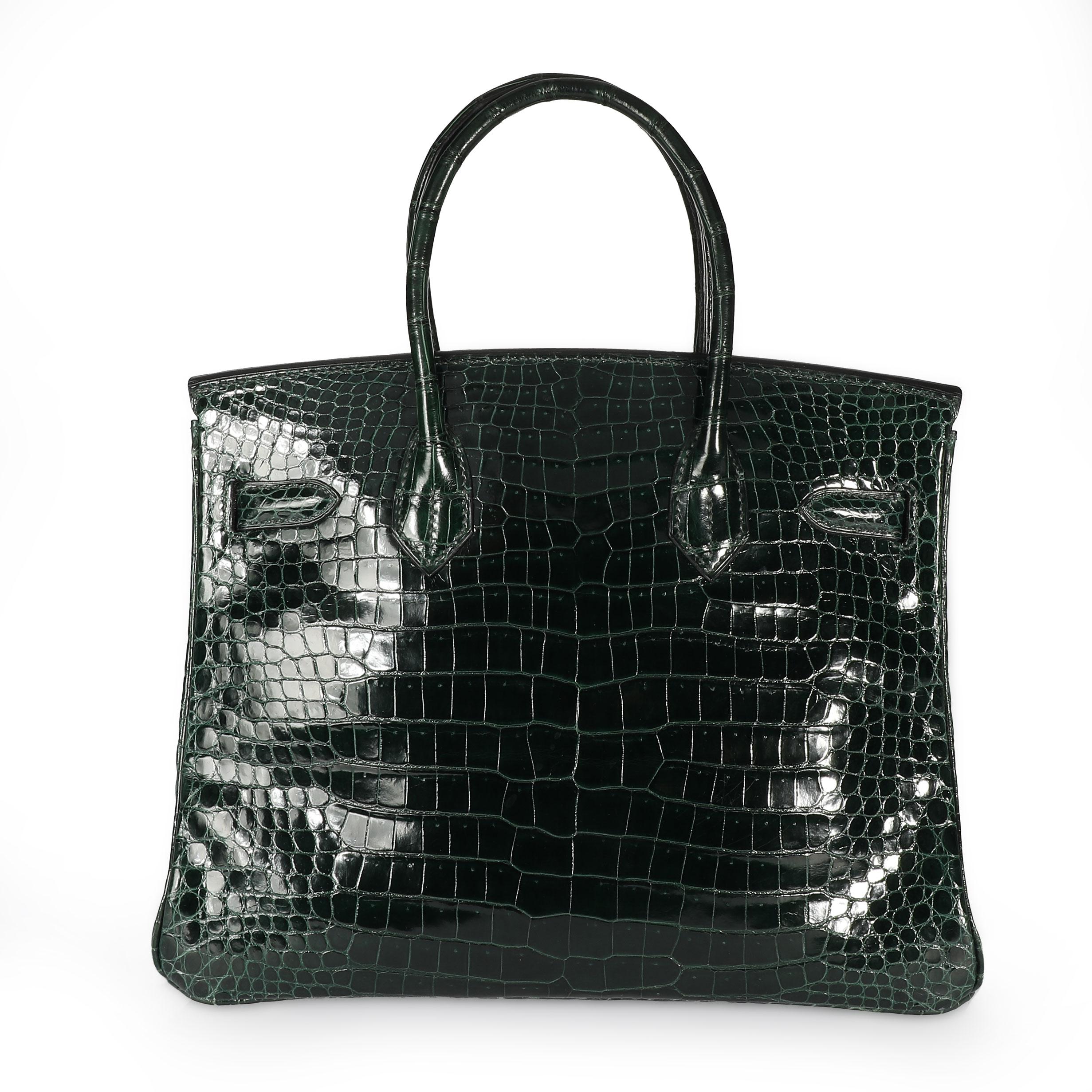 Hermès Shiny Vert Fonce Porosus Crocodile Birkin 30 PHW
SKU: 108516

The holy grail of handbags: the Hermès Birkin. First introduced in 1984, the Birkin is crafted entirely by hand over the course of 18 hours. Highly covetable and collectible, this