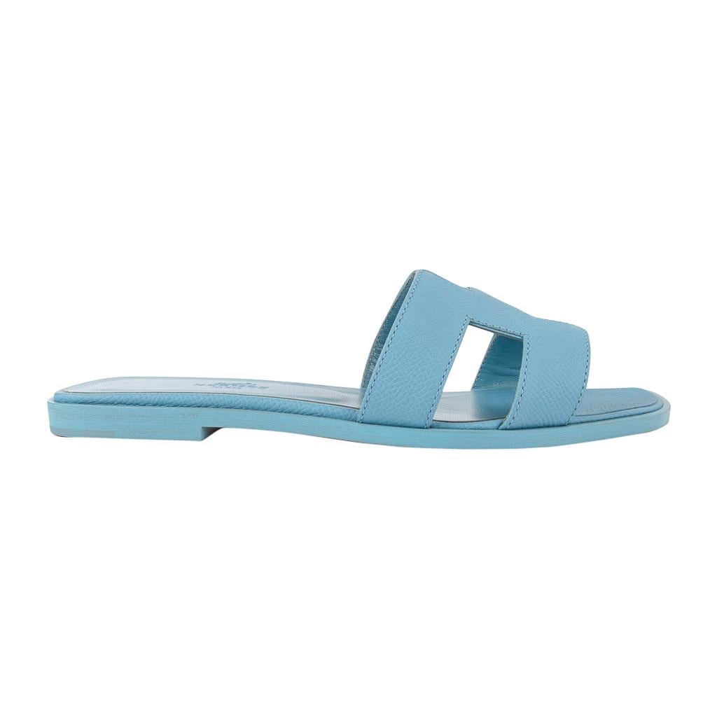 Guaranteed authentic Hermes Oran exquisite Bleu Littoral calfskin slide.
The iconic top stitched H cutout over the top of the foot in sublime calfskin.
Embossed Bleu Littoral calfskin insole. 
Wood heel with leather sole. 
Comes with sleepers and