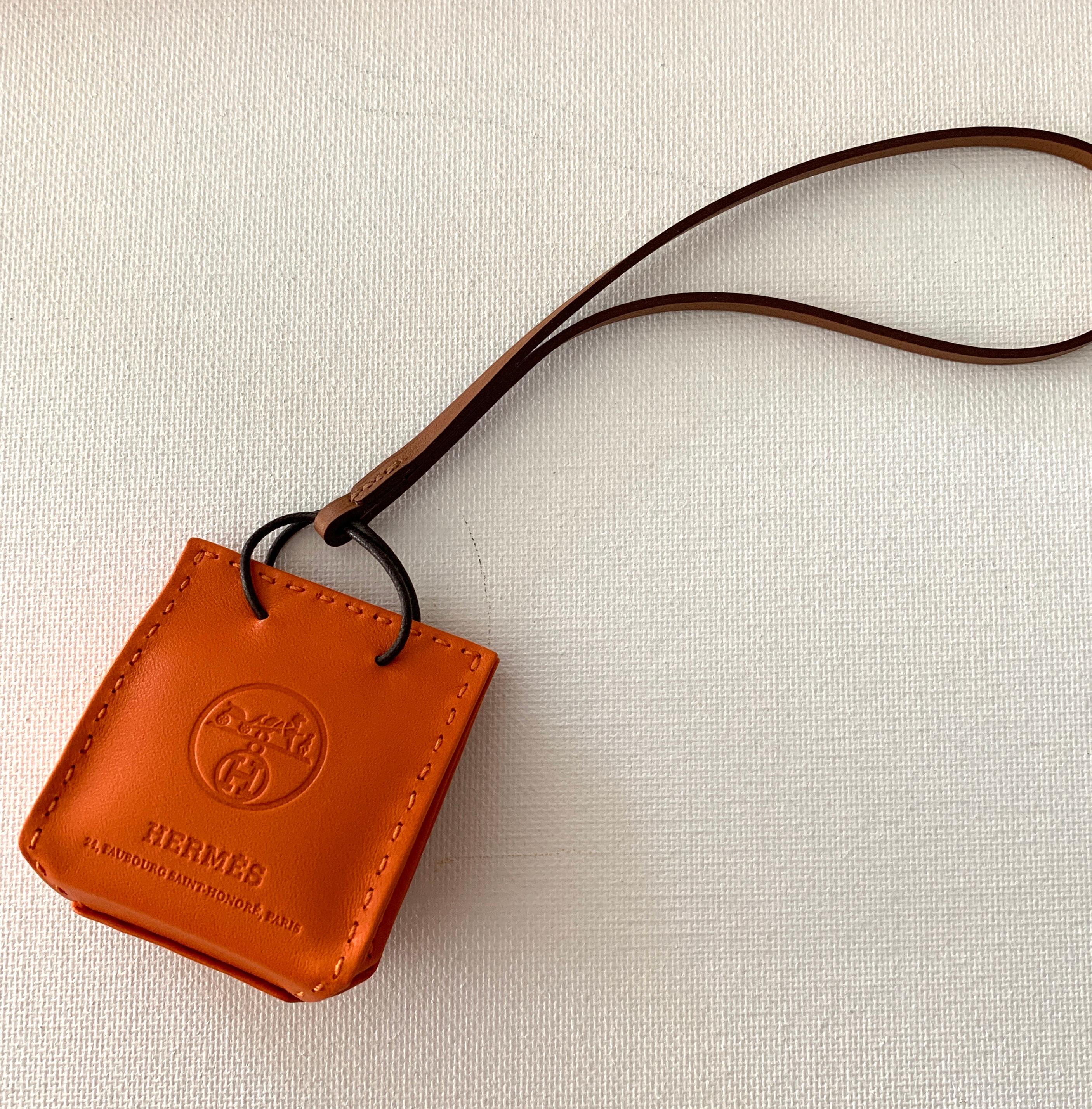 New Release
Hermes Orange Leather Shopping Bag Charm
Condition is New never worn
Measures 2.25