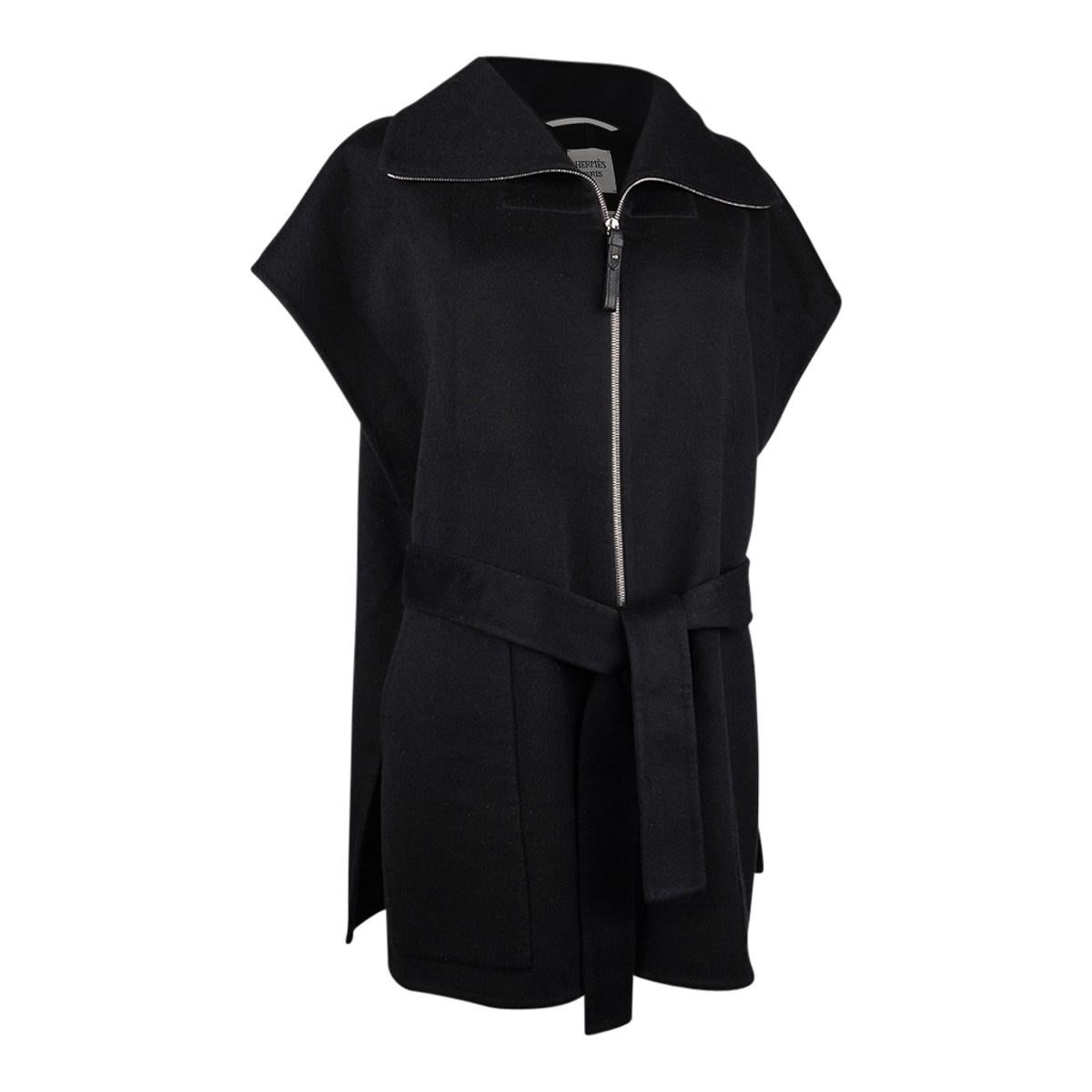 Mightychic offers an Hermes Short Vest featured in Black Double Face Cashmere.
Chic, versatile and timeless and can be worn numerous different ways.
Knotted belt leaves the rear unbelted with a swing coat effect.
Front zip with leather pull.
Funnel
