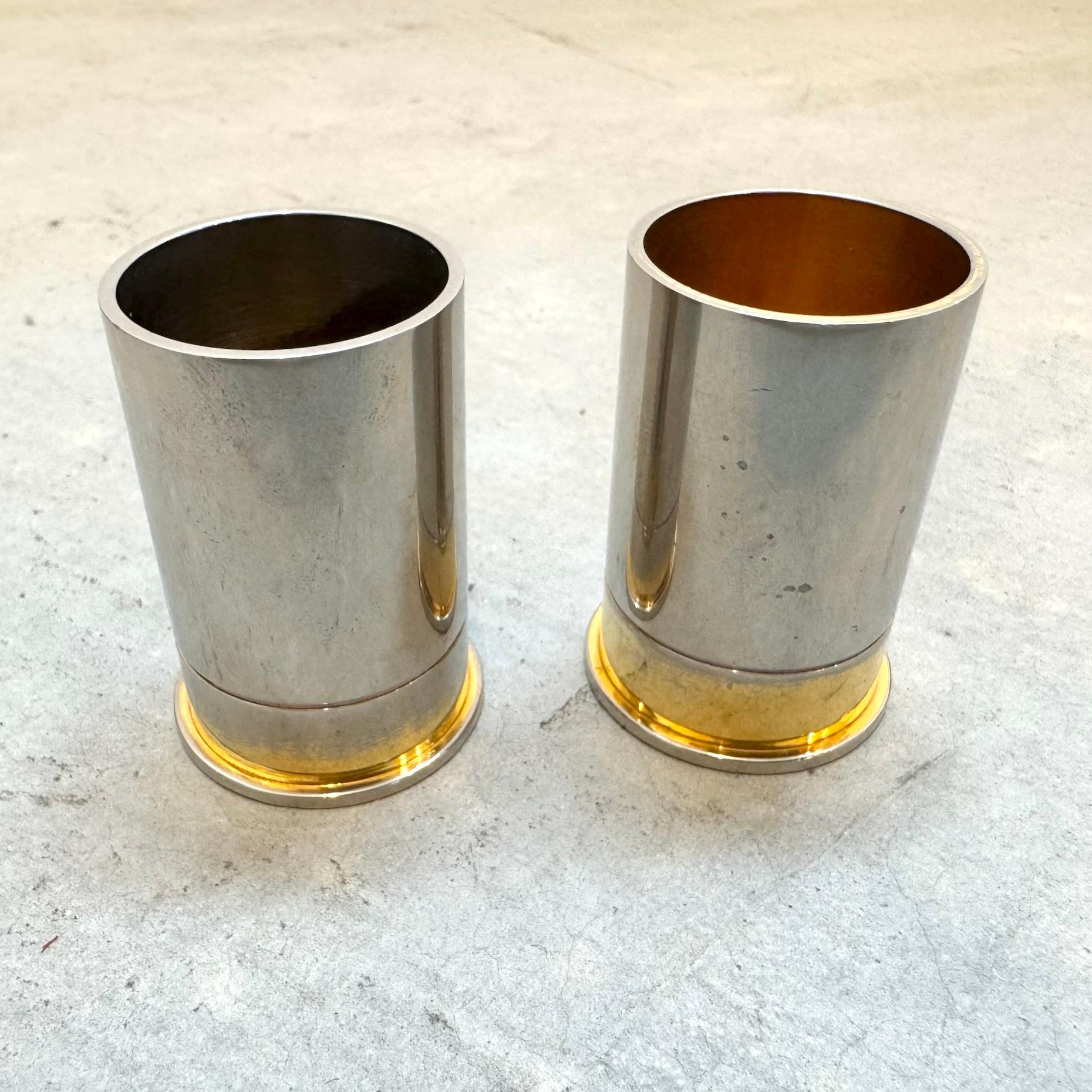 Channel the spirit of refined ruggedness with these handsome vintage Hermès pen holders, crafted in the 1980s and styled after oversized shotgun shells. An exquisite fusion of luxury and novelty, these pieces are a bold statement on any desk or