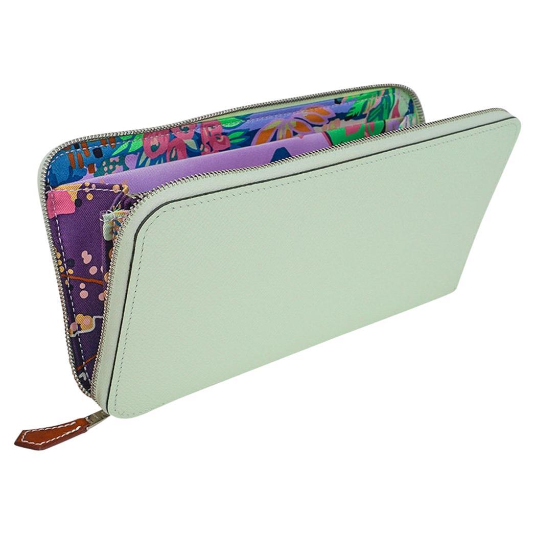 Mightychic offers an Hermes Silk' In Classique long wallet featured in exquisite Vert Fizz.
Gorgeous fresh very light green.
Beautiful in Epsom leather,  Barenia leather zip pull and palladium hardware.
Interior has a divided compartment, with a