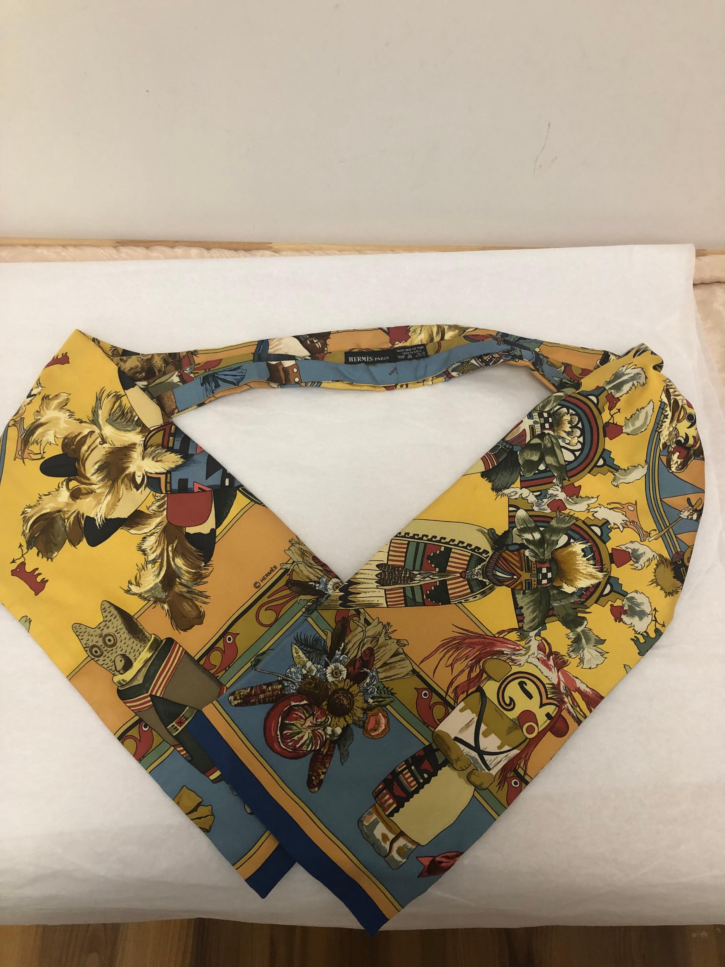 Designed by Kermit Oliver, this silk ascot/scarf represents images from the Navajo Chimayo People legends.
Kermit Oliver born in Texas designed many scarves for Hermes, most being of Native American culture.
