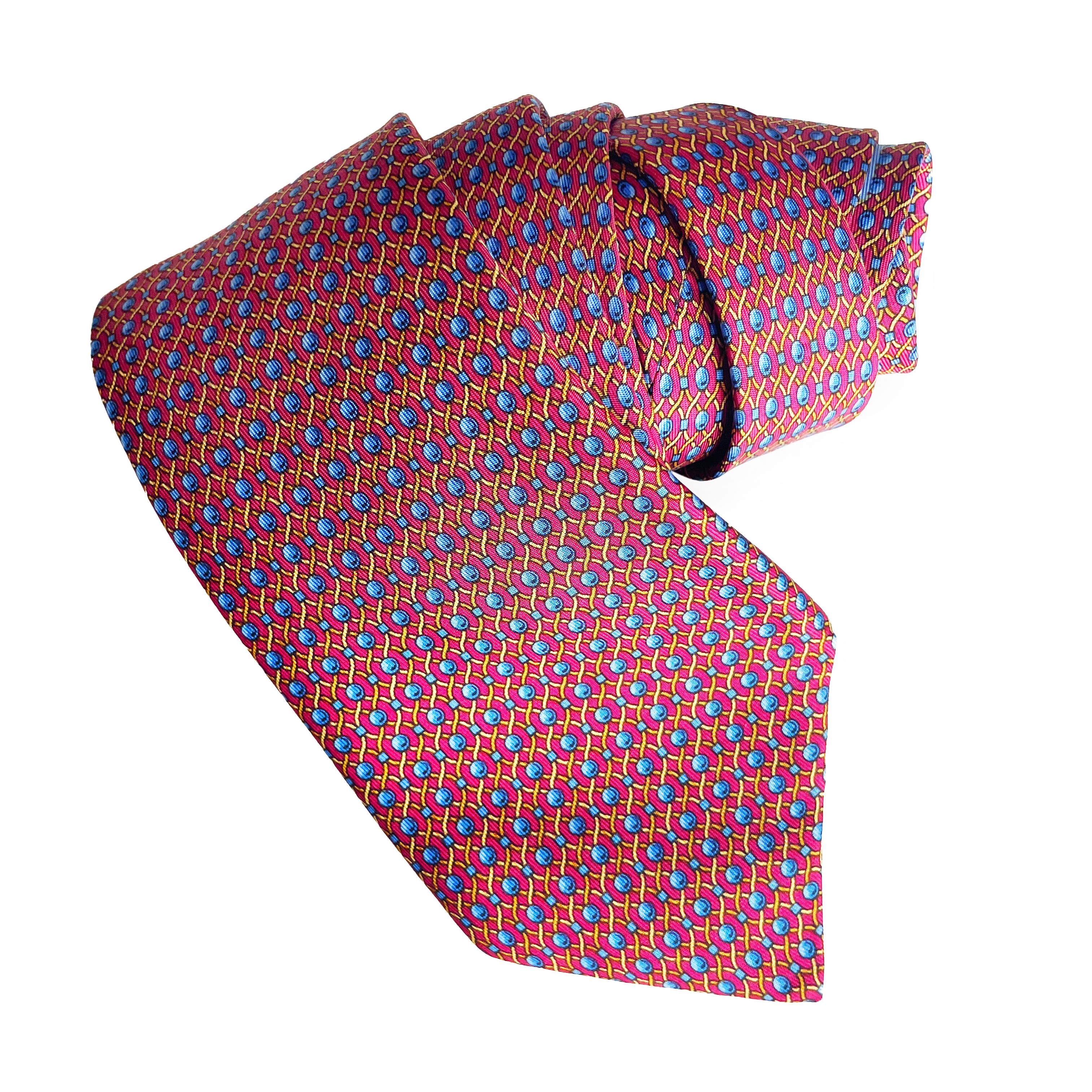 Preowned, vintage Hermes necktie with colorful rope print, likely made in the 90s.  Made from silk, it features an abstract rope and ball pattern throughout.

Perfect for those of you who enjoy luxury accessories - or for those who collect.  The