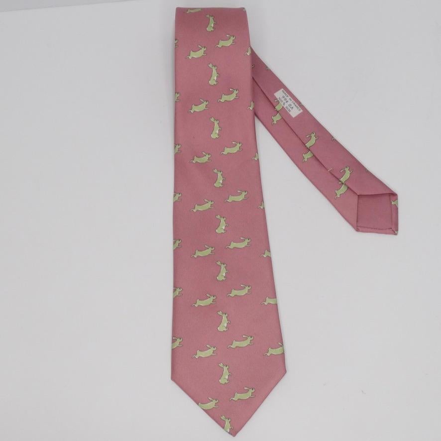 Super fun Hermes pink and green 100% silk printed tie! Featuring an adorable rabbit pattern perfect for Easter! Style this with a Gucci button down, some Hermes trousers and Valentino loafers to complete the look. In excellent condition with no