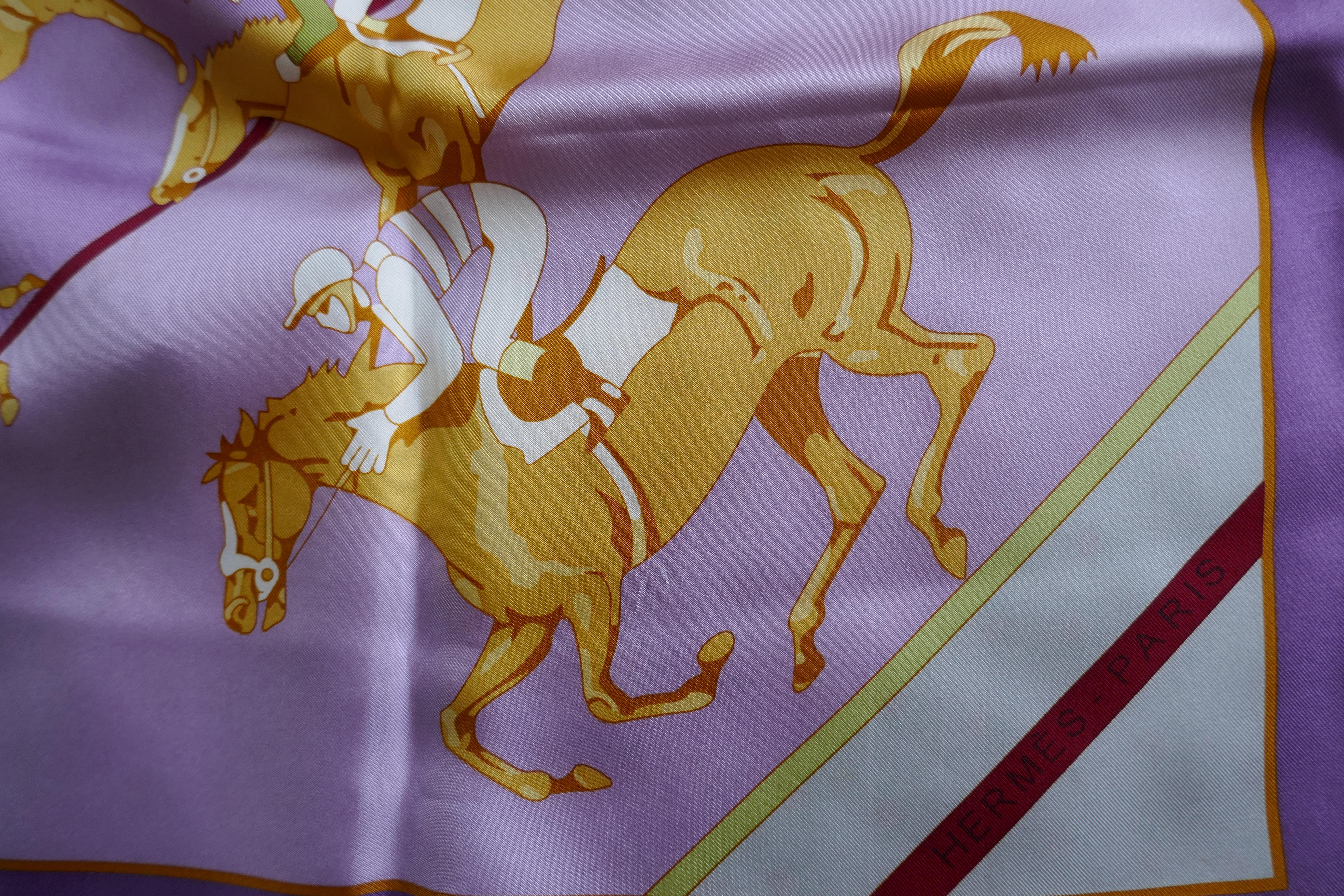 HERMÈS Silk Scarf, Benoist Gironiere design “Les Courses” 

In unworn good condition,  
Logo and HERMÈs-Paris
The scarf is in Lilac and Burgundy
The Scarf is 35” x 35” 100% Silk with hand rolled hems

F45